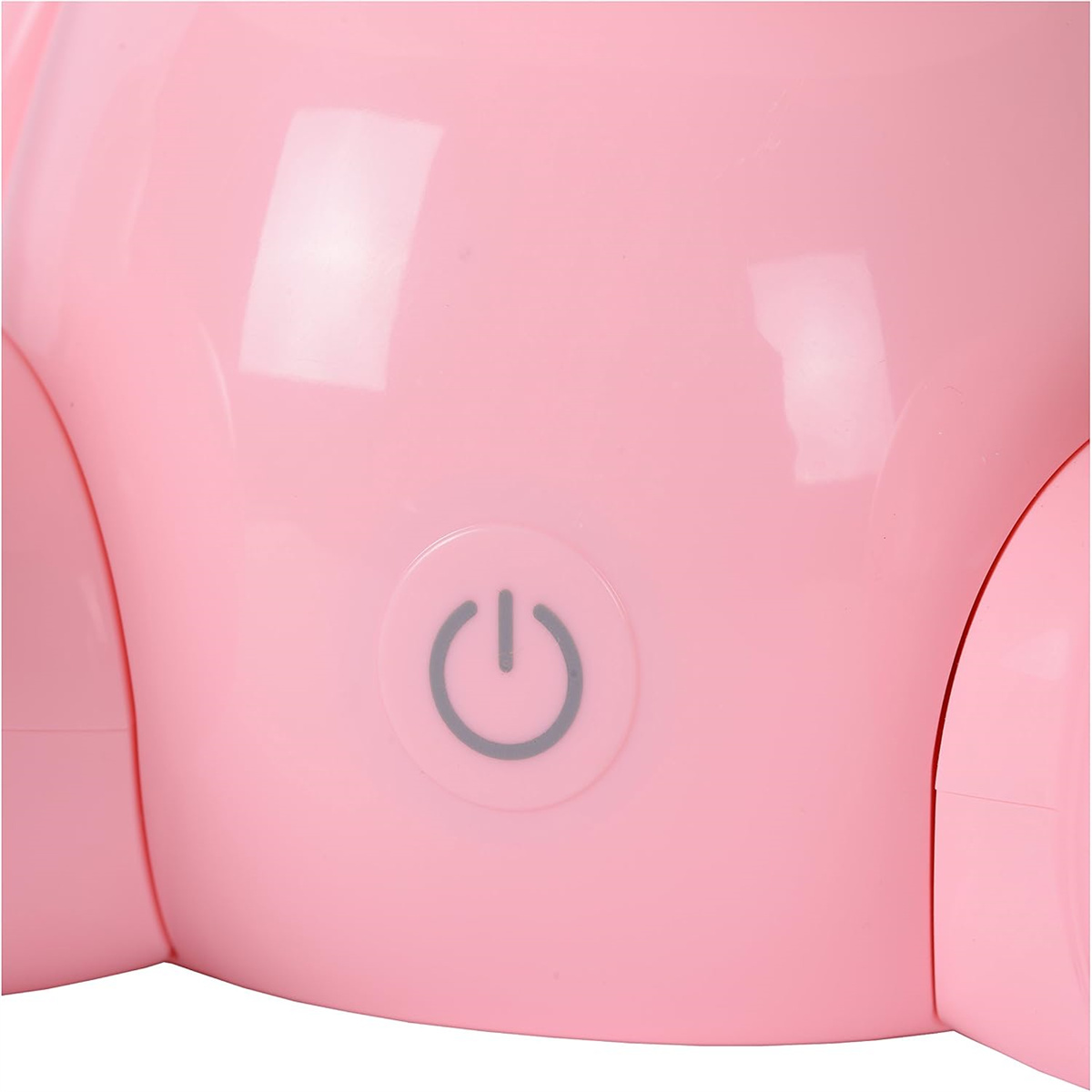 Nahaufnahme eines rosa Kunststoffgeräts mit einem Ein-Aus-Schalter.