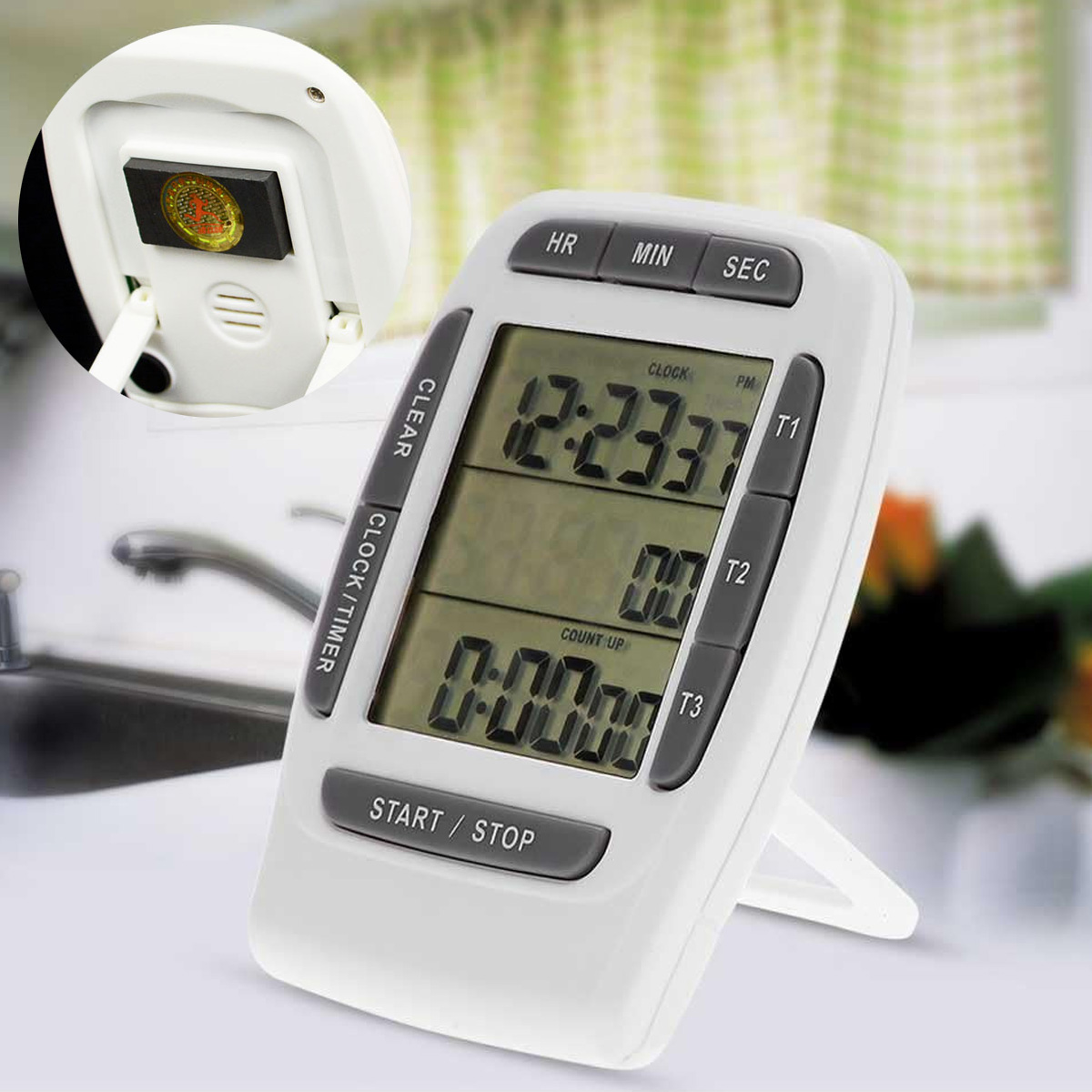 Weißer digitaler Küchentimer mit Zeitanzeige. Tasten: HR, MIN, SEC, CLEAR, CLOCK/TIMER, START/STOP.