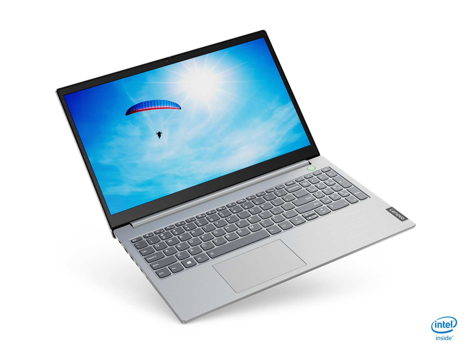 Laptop mit blauem Himmel und Gleitschirm. Der Laptop ist offen, hellgrau.