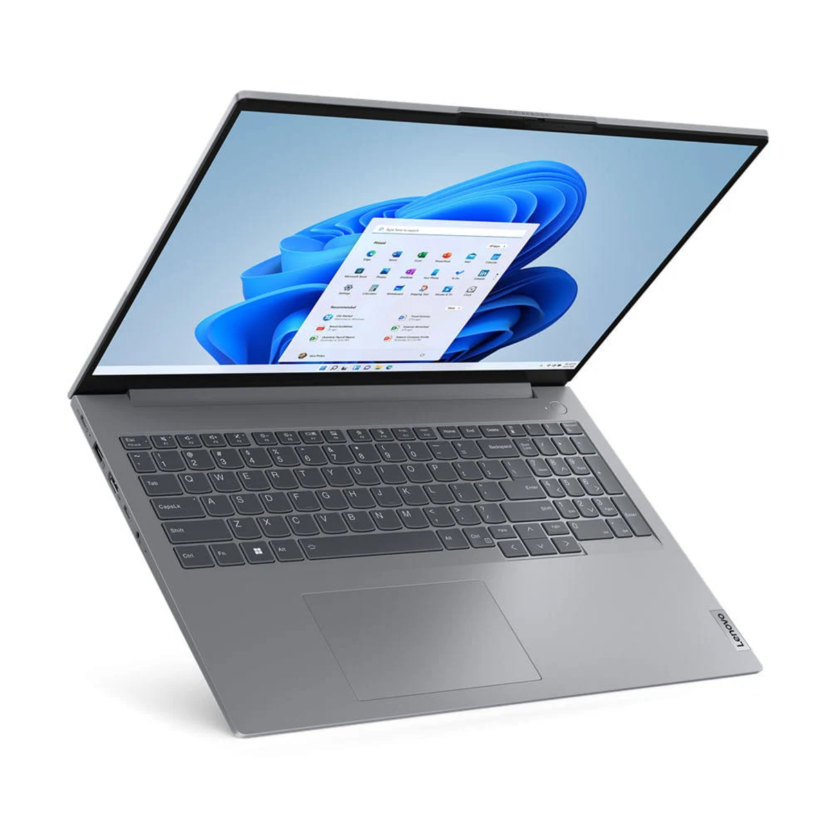 Un portátil Lenovo gris está ligeramente abierto, mostrando una interfaz de Windows 11. La pantalla muestra un escritorio con fondo azul abstracto.