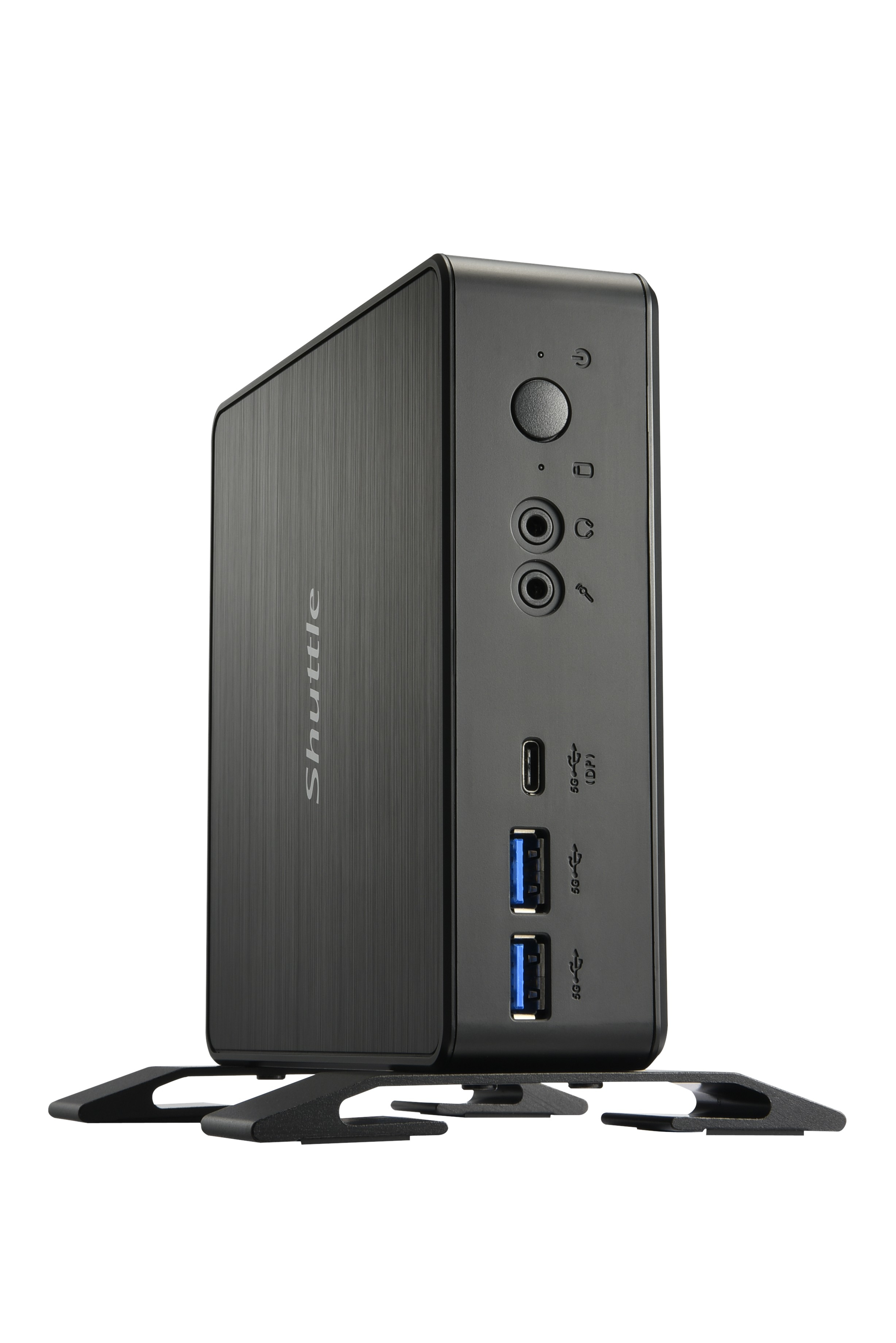 Torre PC Shuttle nera in posizione verticale, con varie porte. Sfondo bianco.