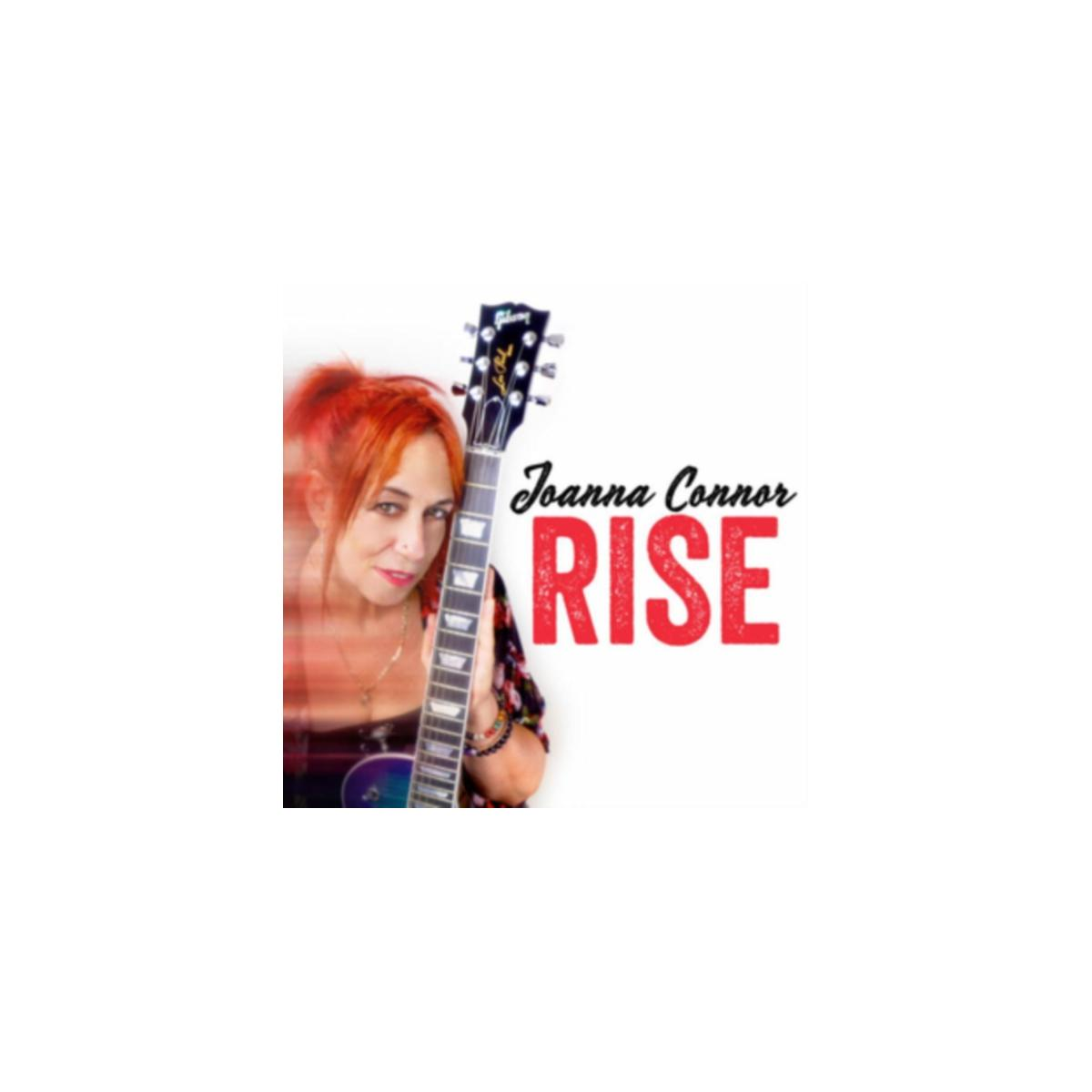 Albumhoes: Roodharige vrouw met gitaar, titel: RISE, Joanna Connor.