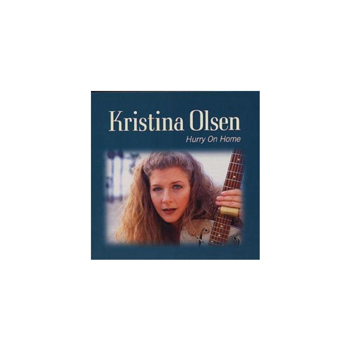 Pochette de l'album de Kristina Olsen. Une femme aux longs cheveux tenant une guitare. Fond bleu.