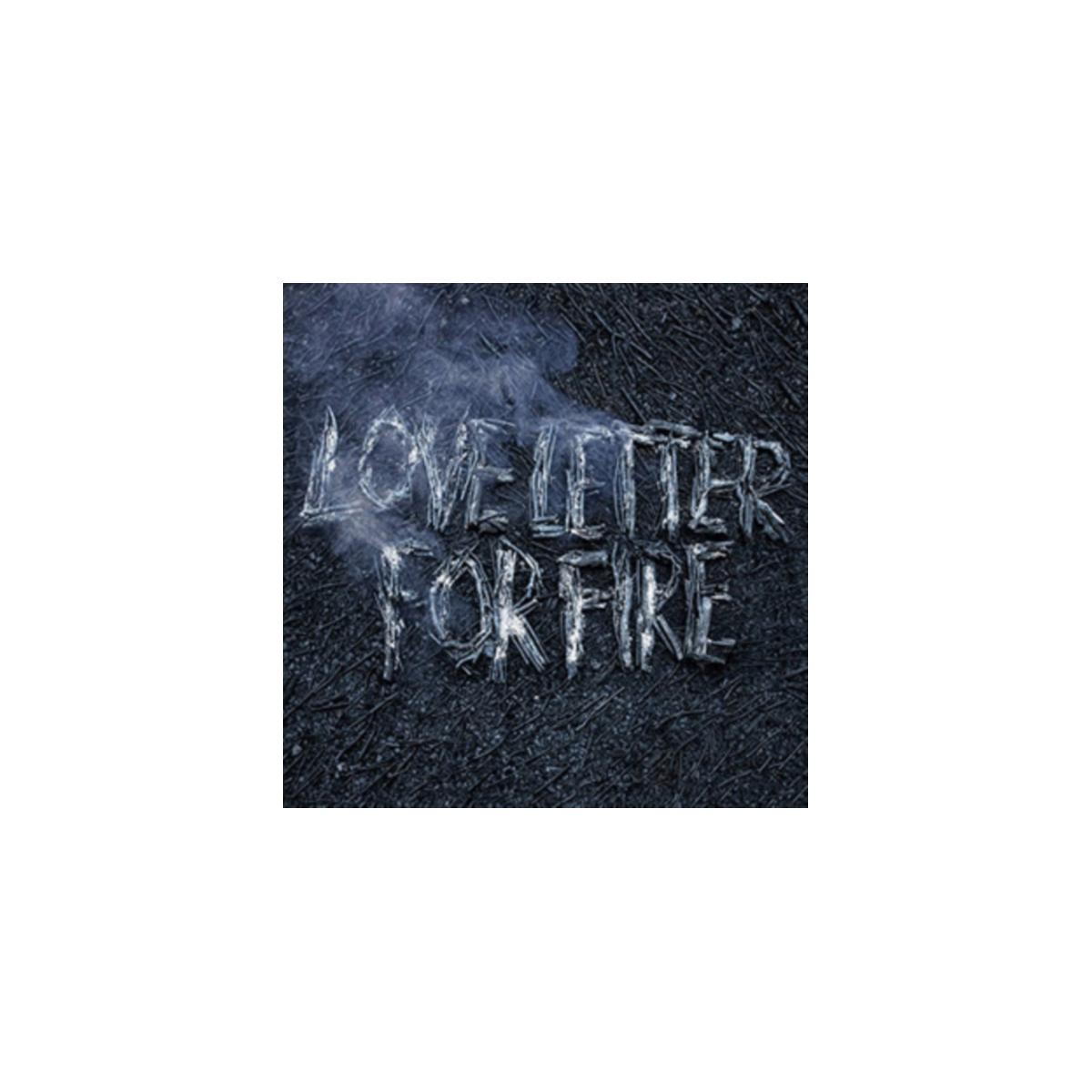 Pochette de l'album Love Letter for Fire. Texte fait avec de la fumée sur une surface sombre.