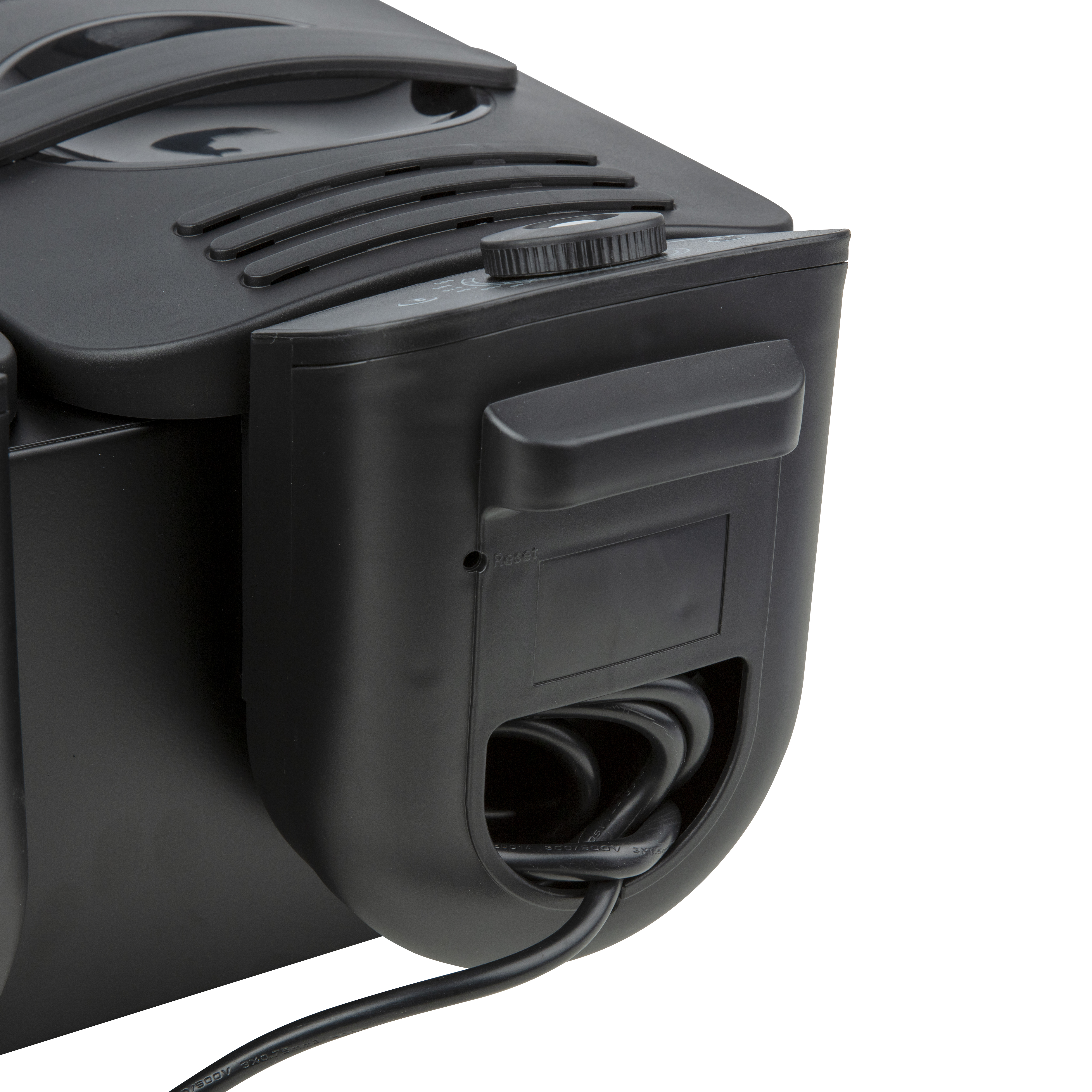 Close-up of a black device. It has a dial and a power cord.
