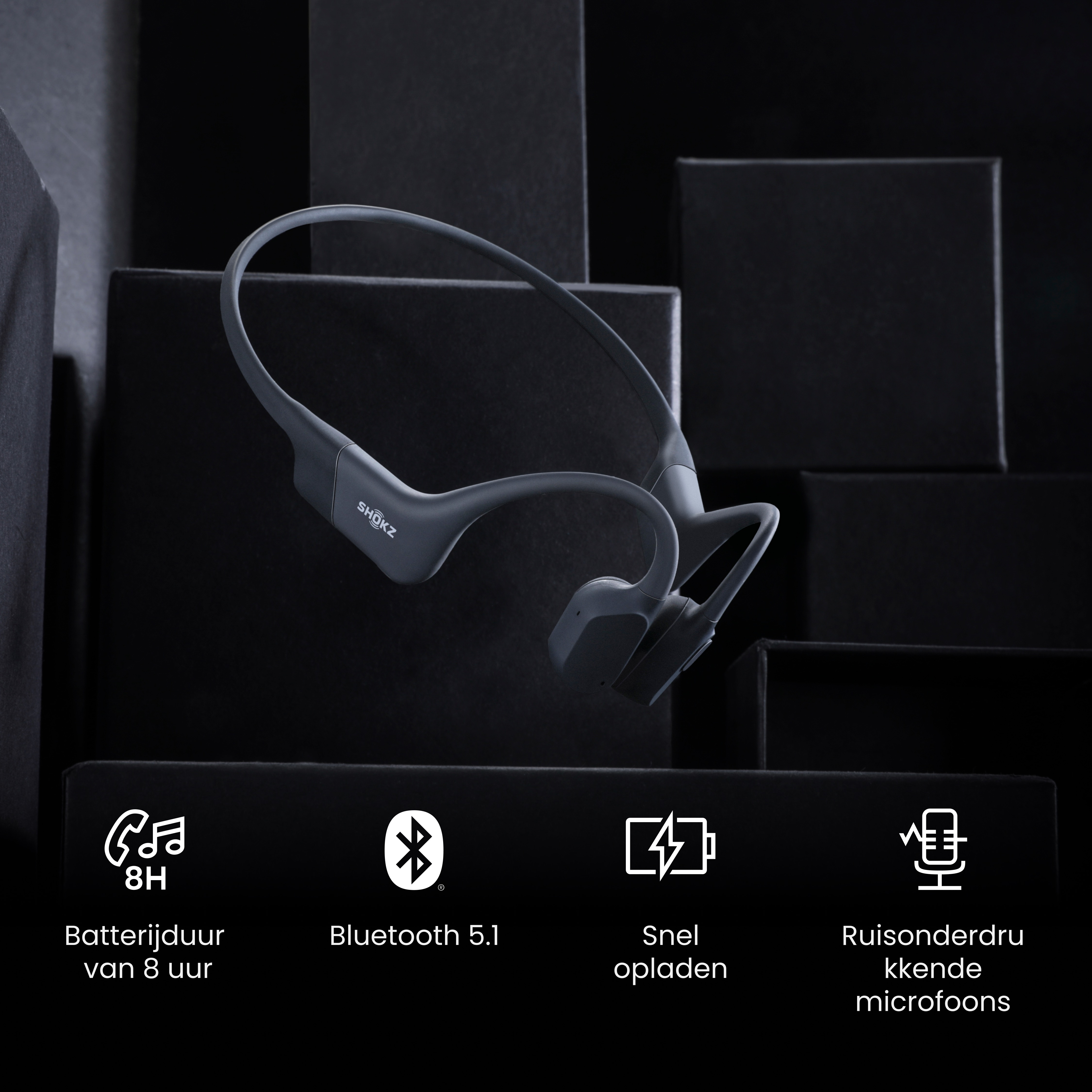 Cuffie Shokz grigie su sfondo nero. Caratteristiche: batteria 8H, Bluetooth 5.1 e ricarica rapida.