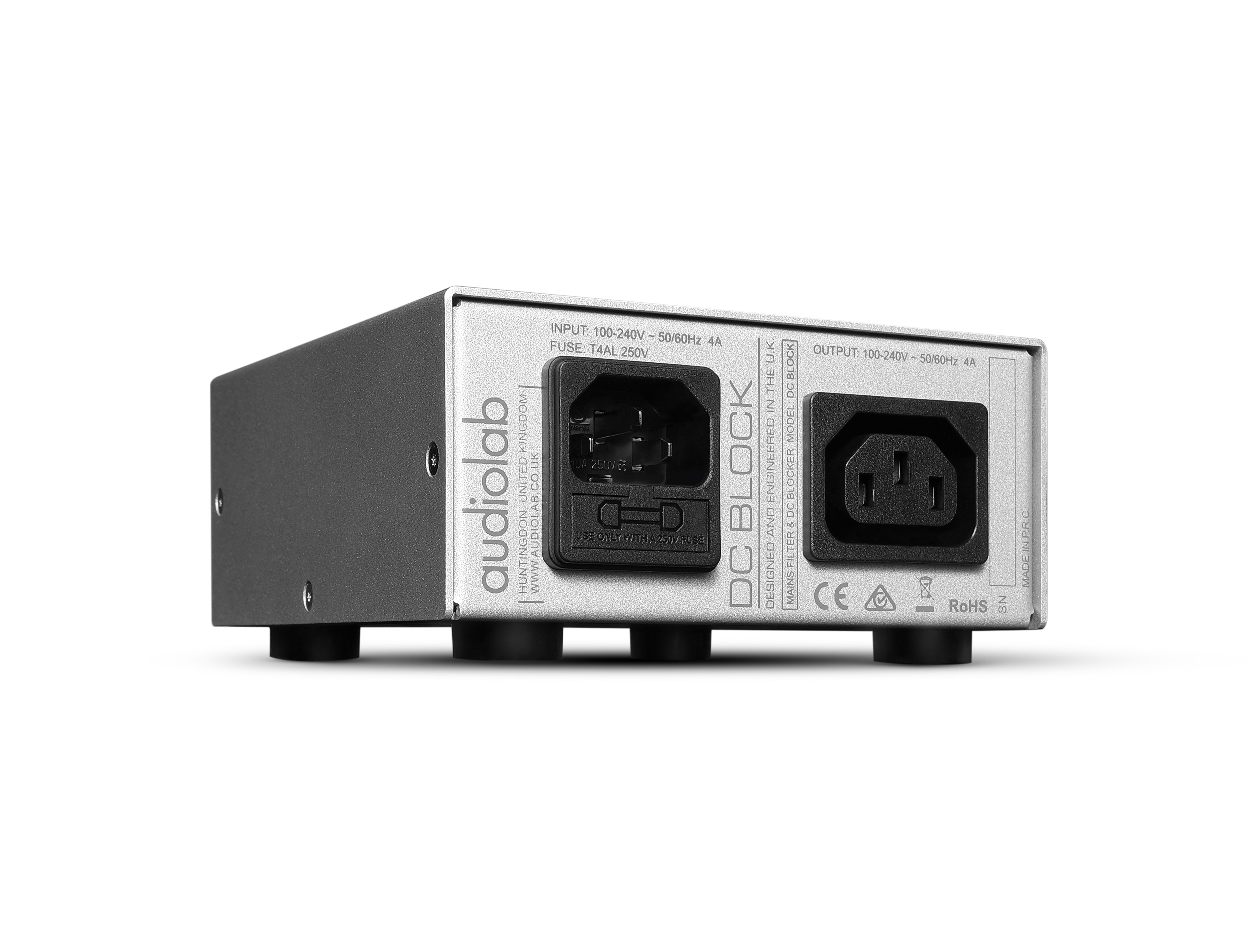 A silver audio device with several input and output ports, and text.