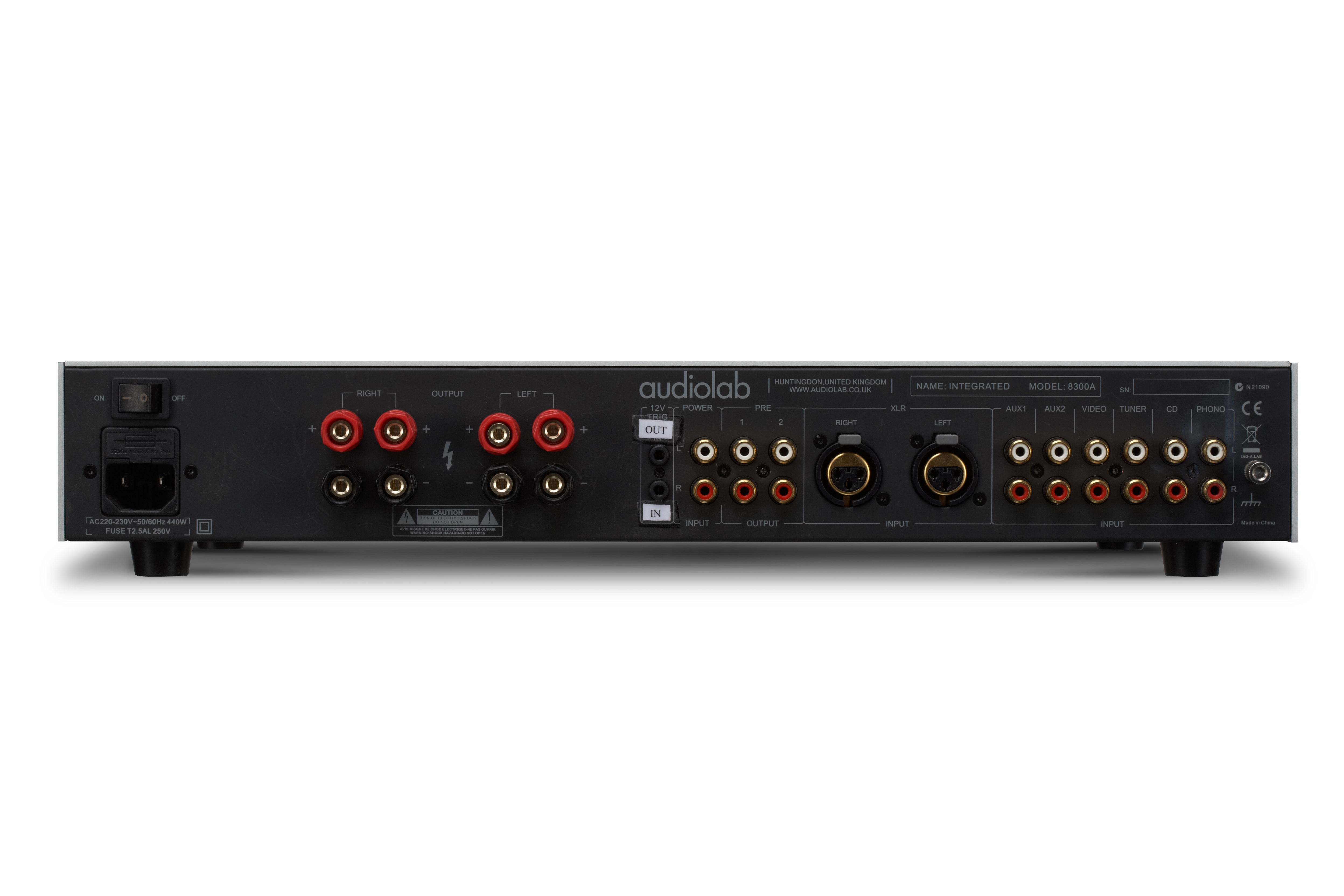 Back of an audio amplifier. It has many input/output jacks, power input, and various connection ports.