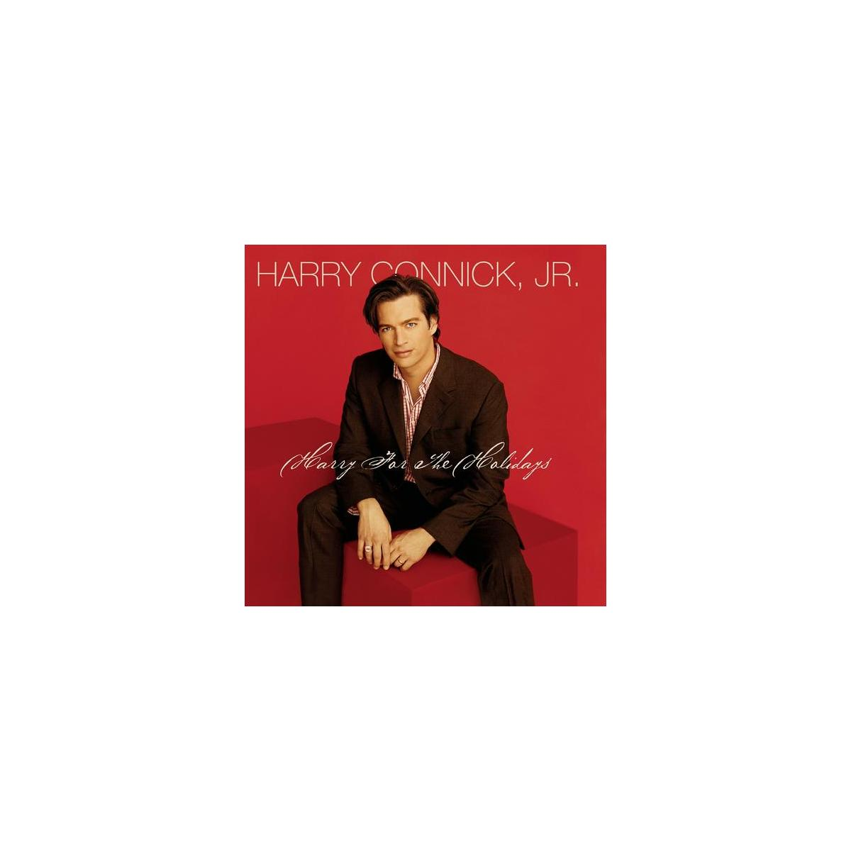 Harry Connick Jr. albumhoes. Hij zit op een rood blok, draagt een bruin pak, rode achtergrond.