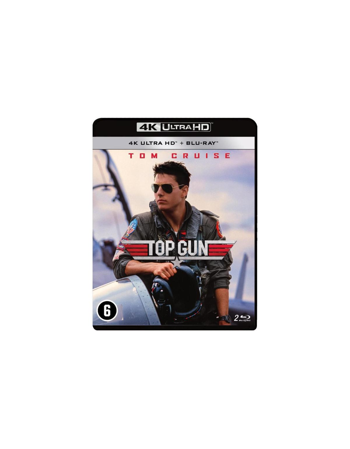 4K Blu-ray-hoes: Top Gun. Tom Cruise in vliegpak naast een vliegtuig. Zwarte achtergrond.