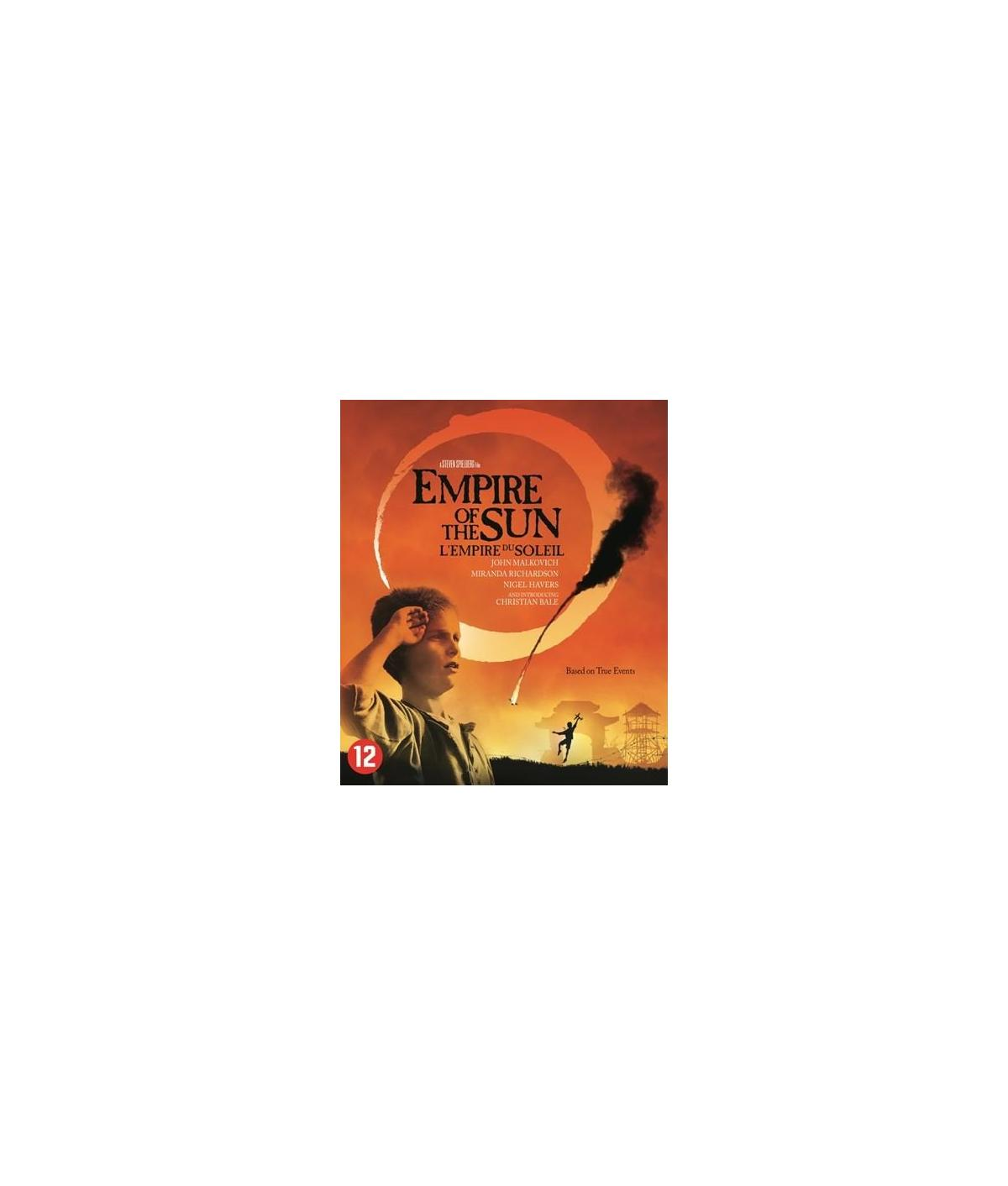 Empire of the Sun filmposter. Toont een jonge jongen en een vurige achtergrond.