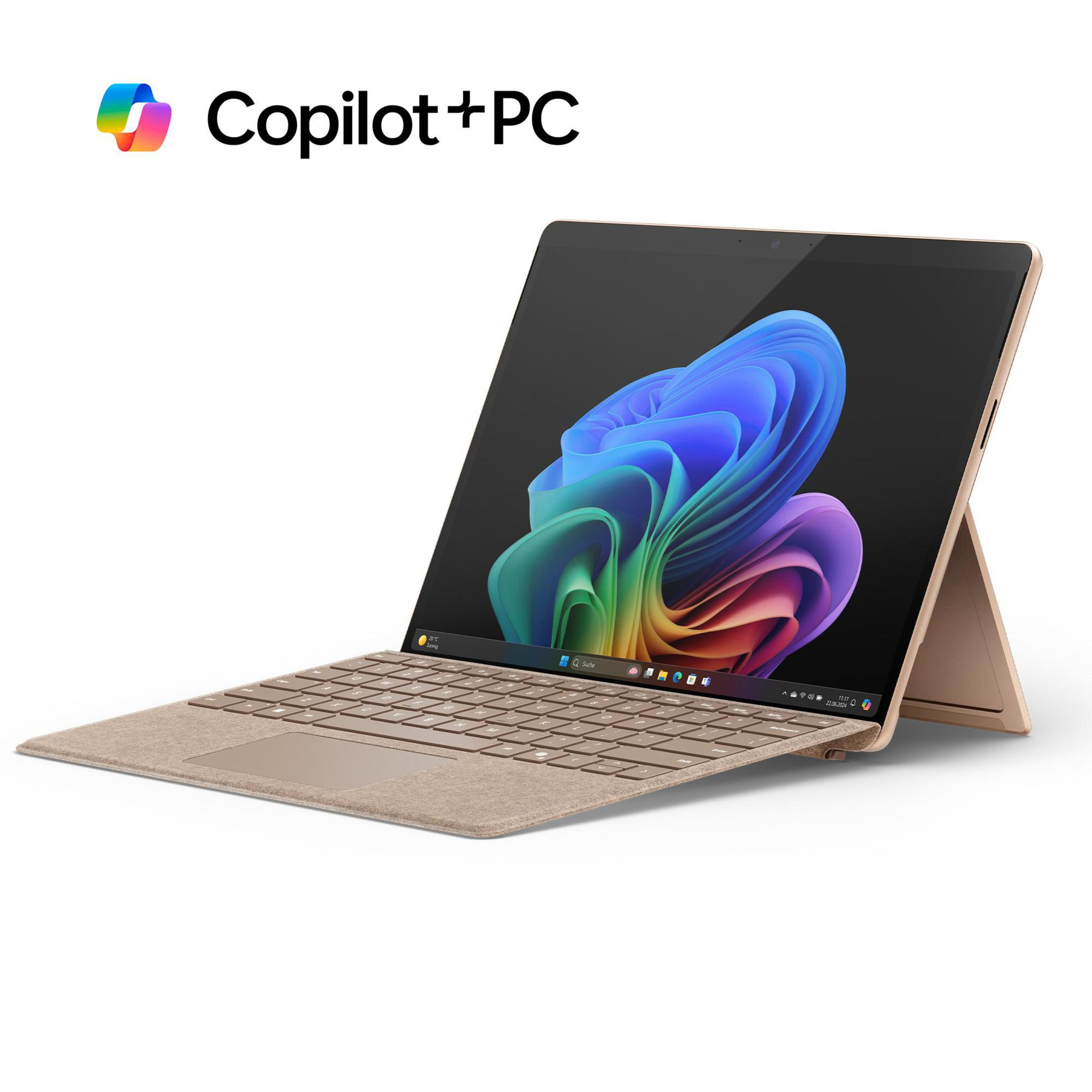 Goldener Laptop mit Tastatur und Bildschirm, mit copilot+PC-Etikett.