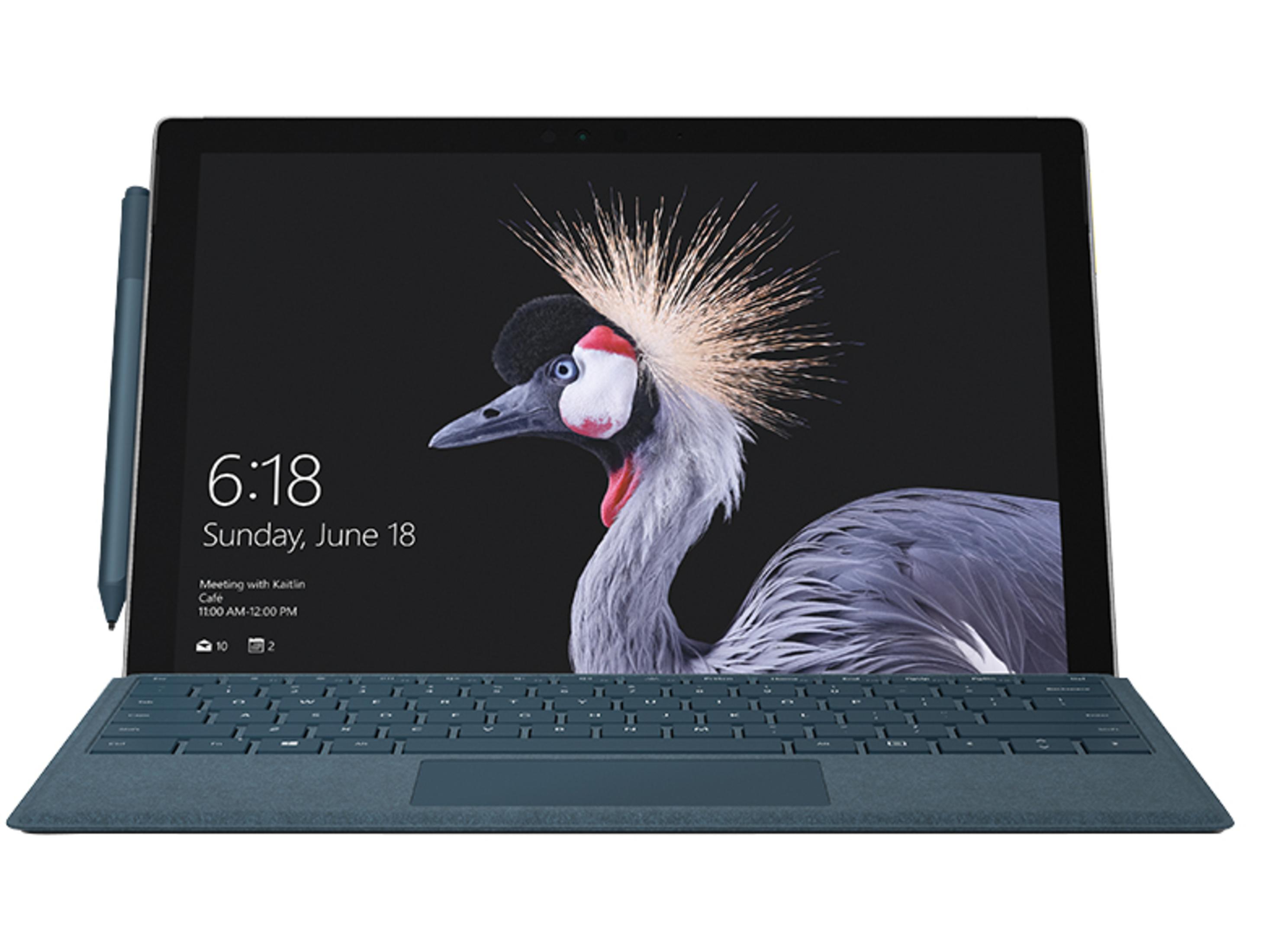 Laptop mit Tastatur und Stift. Der Bildschirm zeigt einen Kranich und die Uhrzeit ist 6:18.