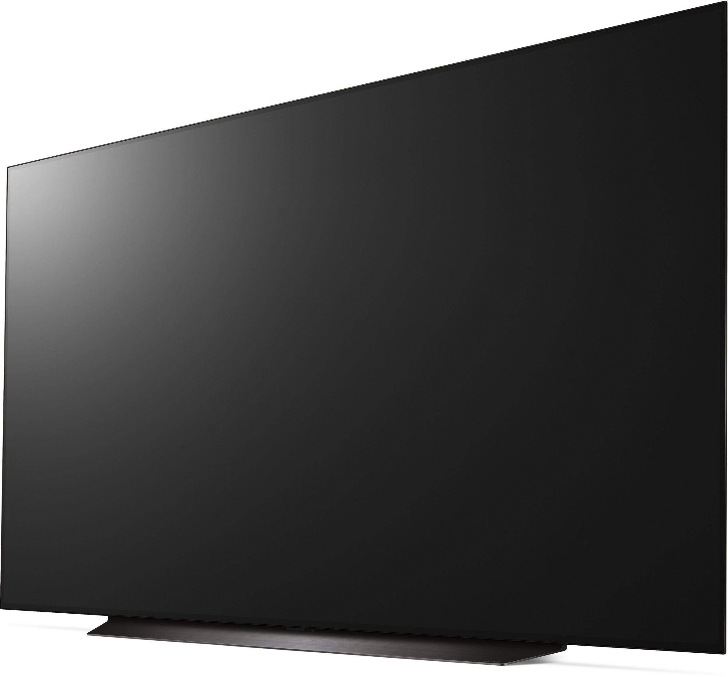 Ein großer schwarzer Fernsehbildschirm mit dunklem, elegantem Design, nach links geneigt.