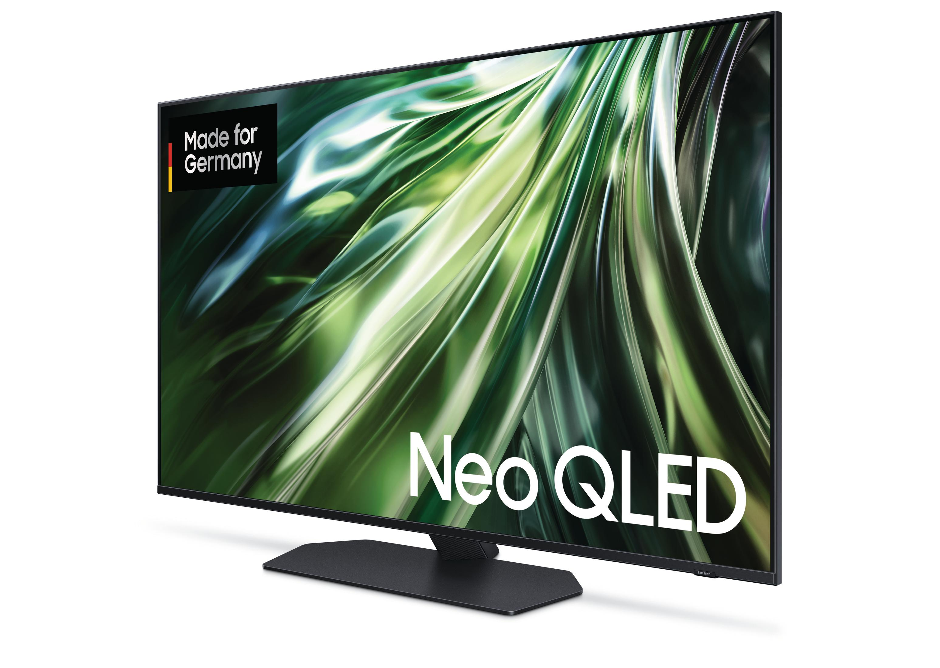 Großer schwarzer Fernsehbildschirm, der ein wirbelndes abstraktes Design zeigt.