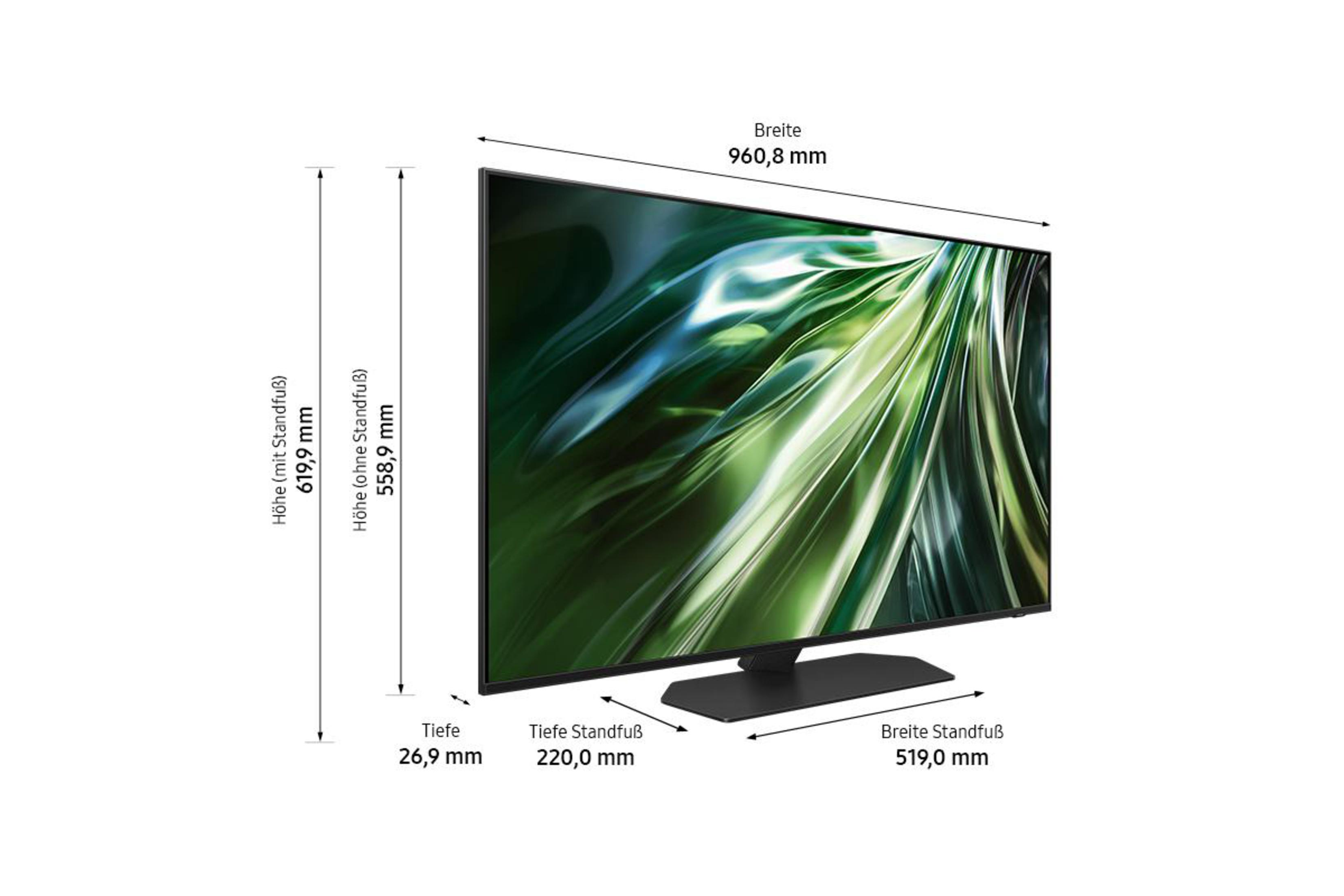 Fernsehbildschirm aus einem Winkel, mit Abmessungen und Maßen. Er steht auf einem schwarzen Ständer.