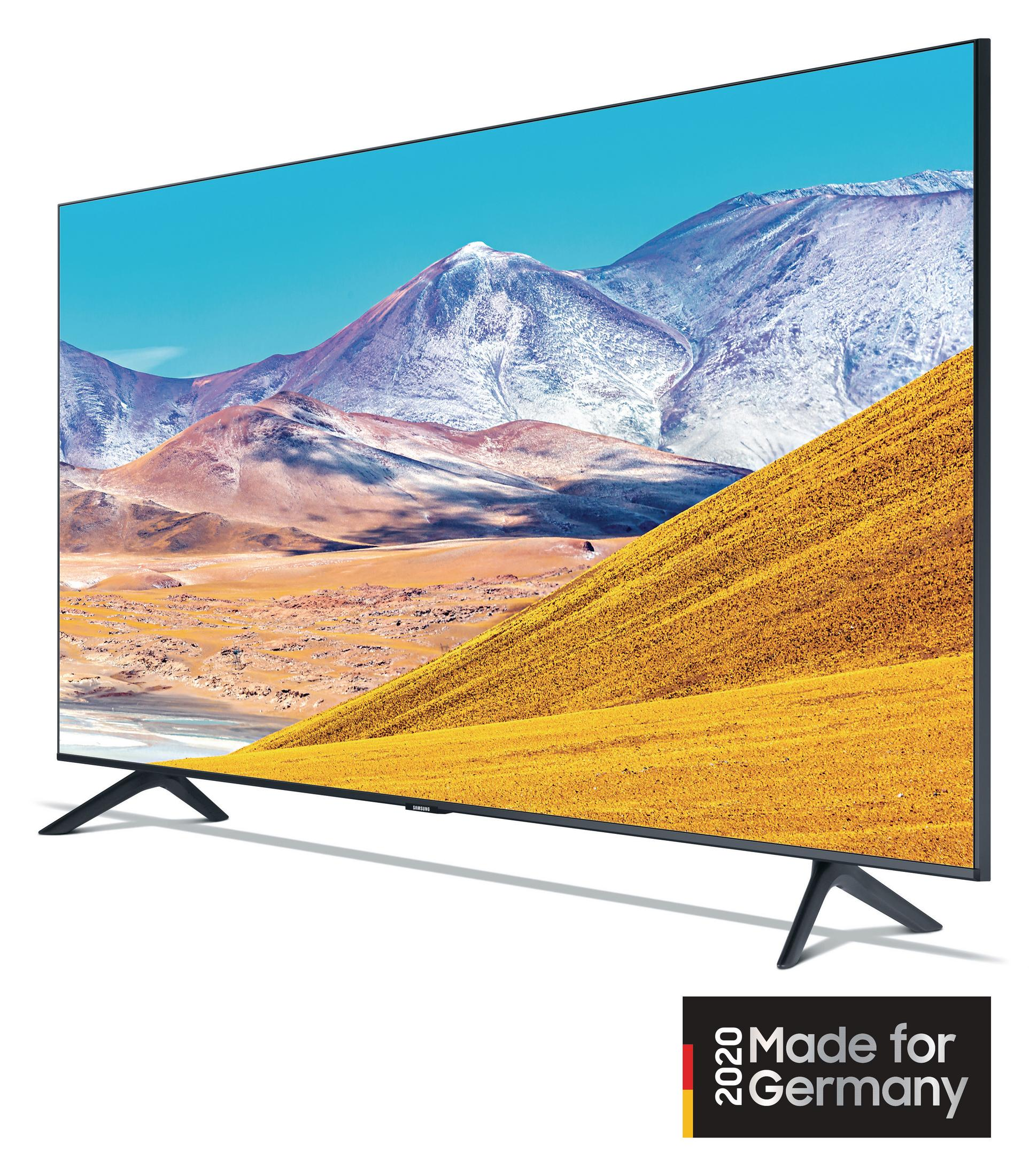 Telewizor Samsung, duży ekran, widok z boku, na białym tle, z pustynnym krajobrazem.