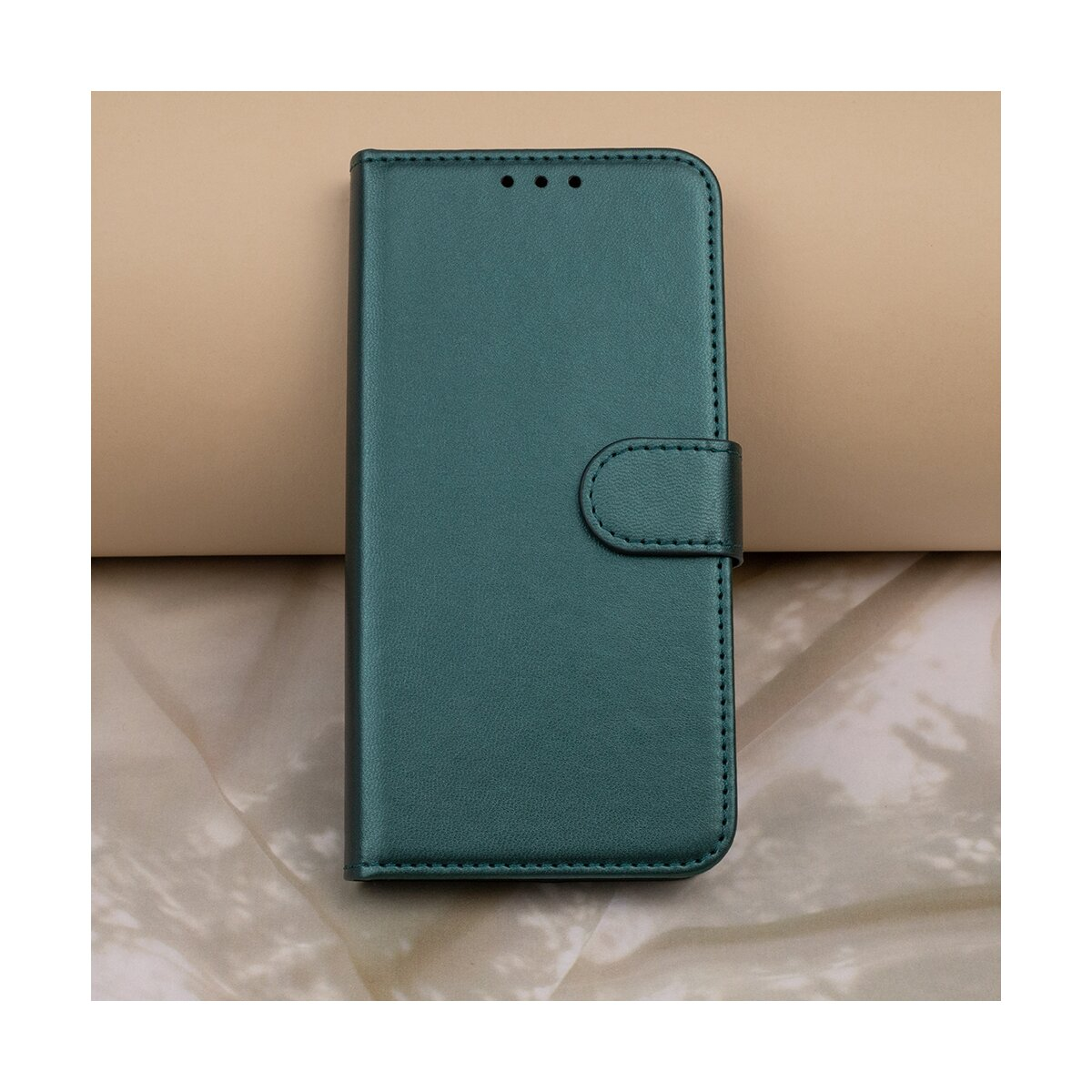 Custodia per telefono turchese con chiusura magnetica, su sfondo beige.