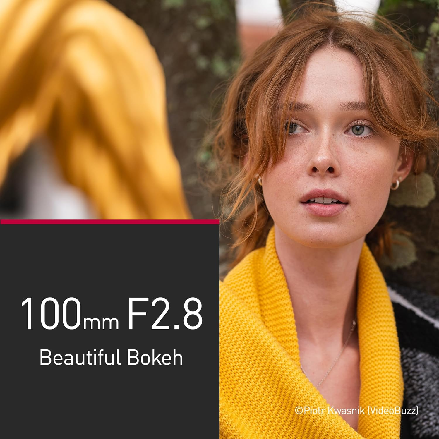 Eine Frau in Gelb mit Text 100mm F2.8 Schönes Bokeh.