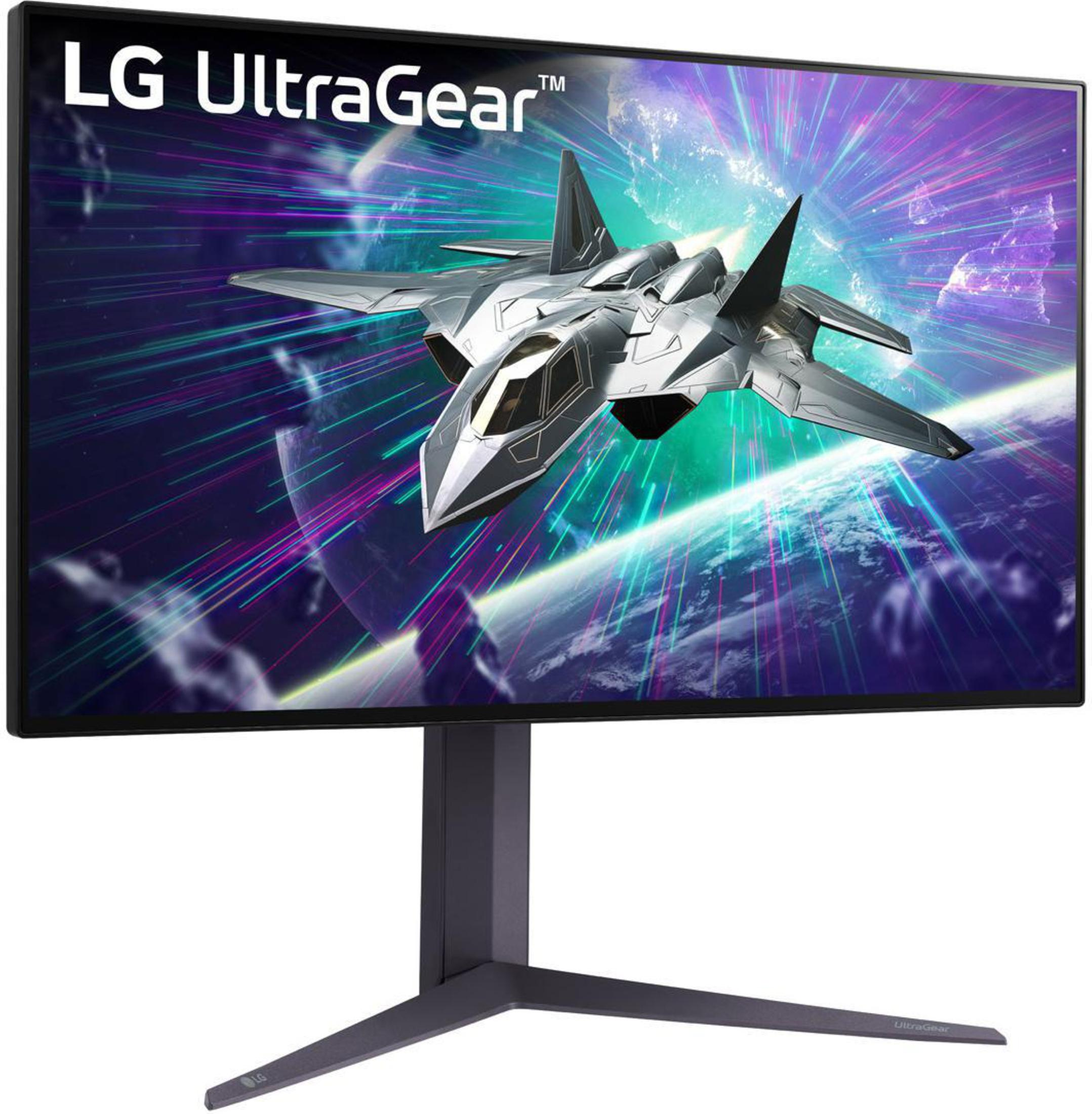 Schwarzer und grauer LG UltraGear Monitor mit einer Kampfflugzeugszene auf lila Hintergrund.