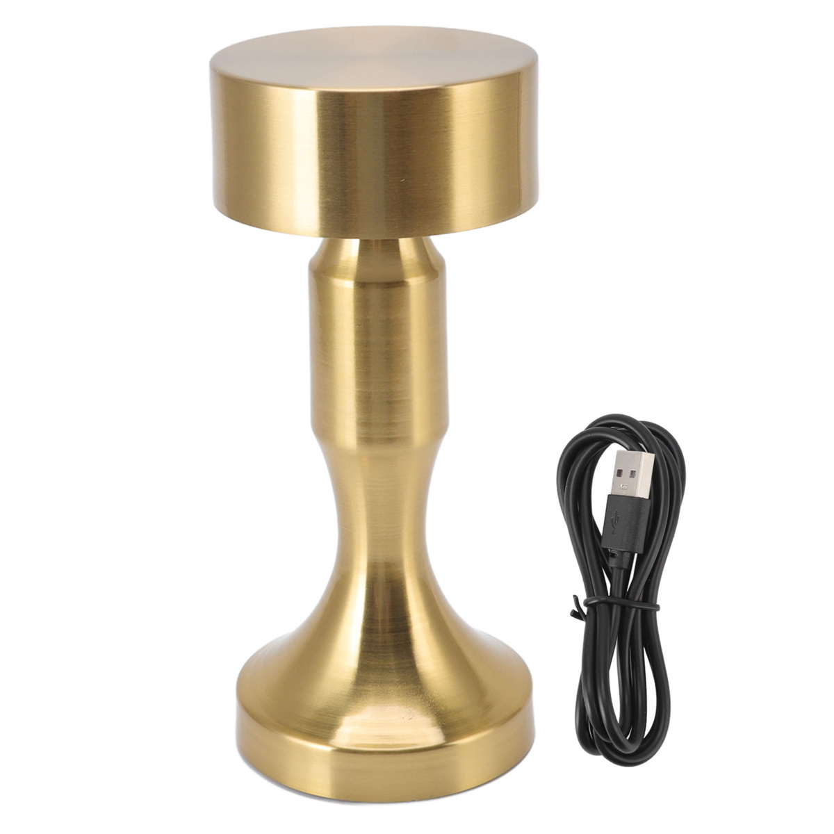 Goldfarbene Schreibtischlampe. Sie ist zylindrisch mit einem schwarzen USB-Kabel daneben.