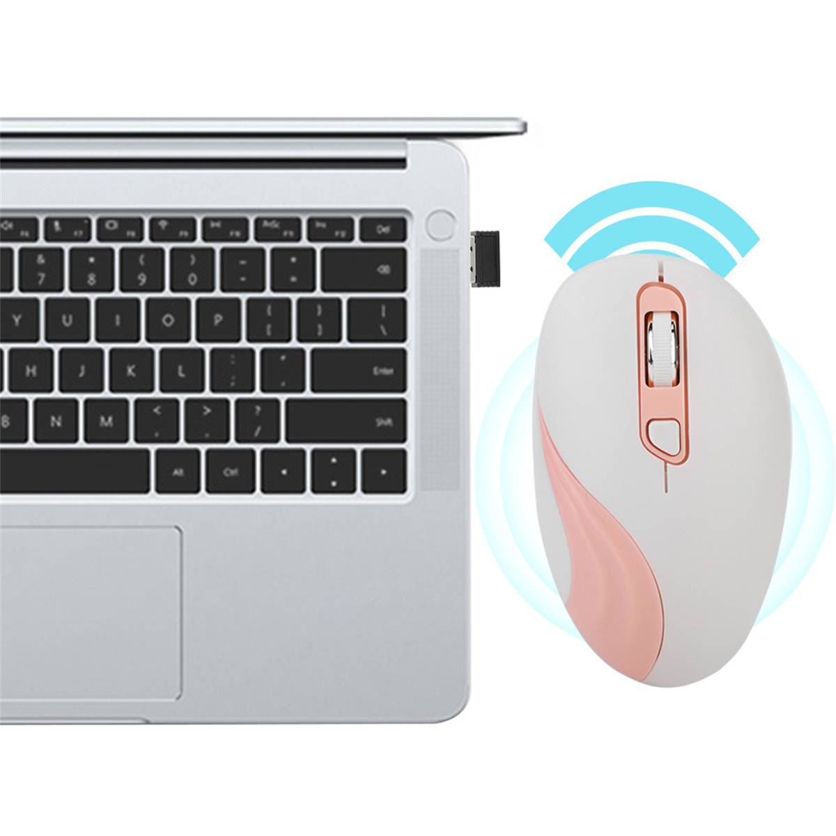 Kabellose Maus und USB-Empfänger neben einem Laptop. Maus ist weiß und rosa.