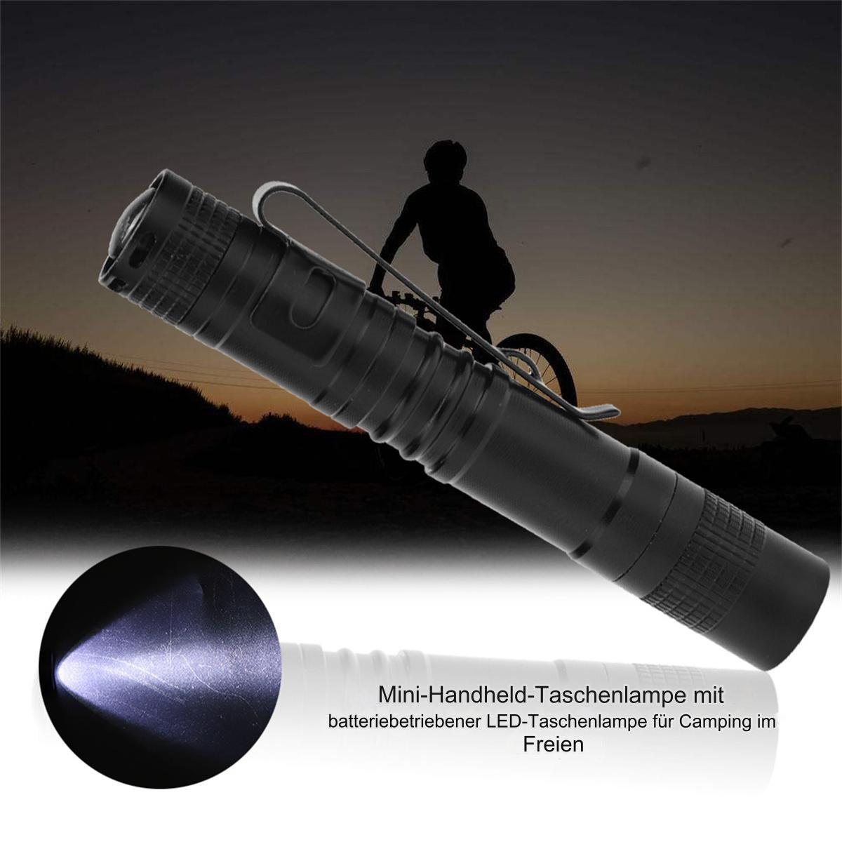Schwarze Taschenlampe mit Radfahrersilhouette und Text auf Deutsch.