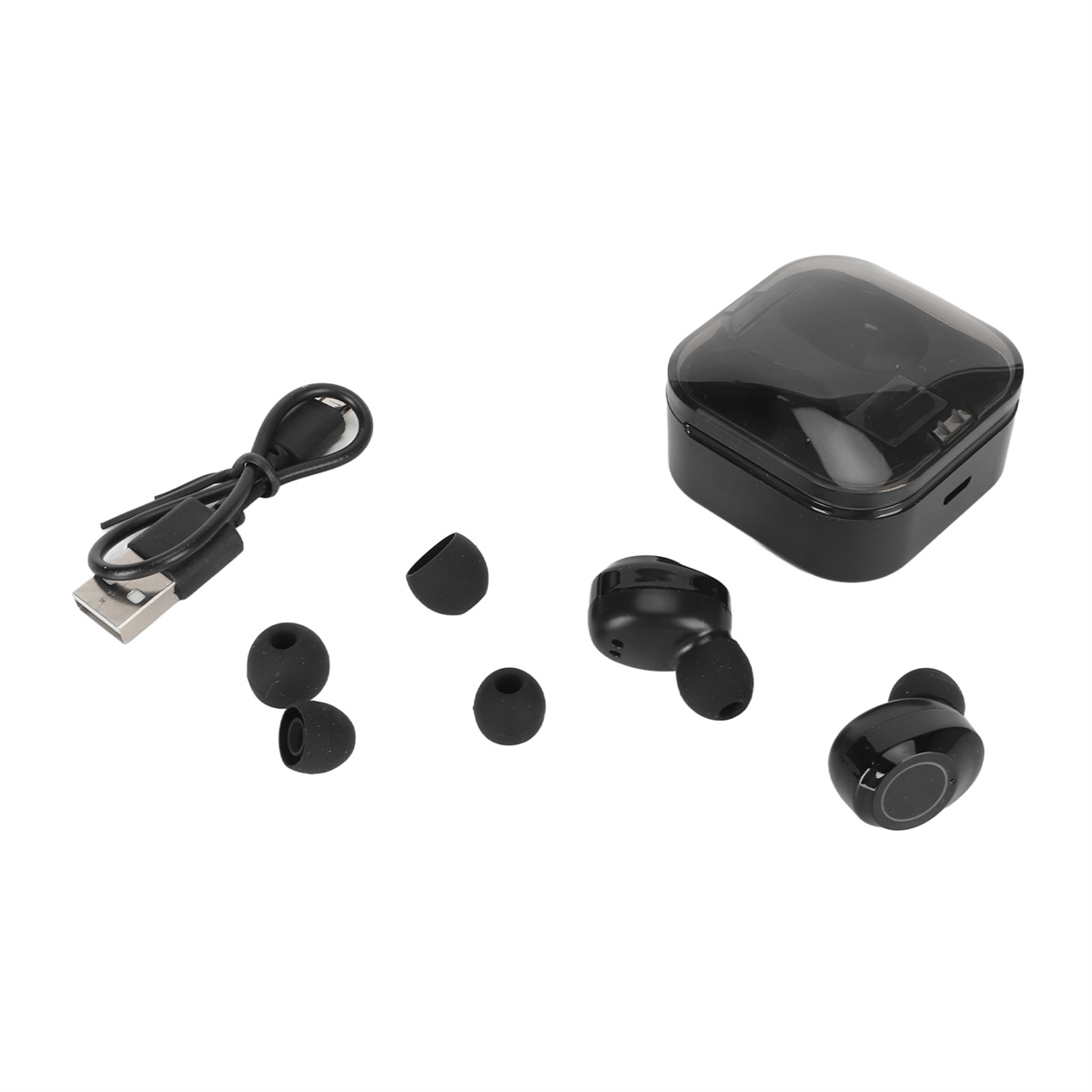 Schwarze kabellose Ohrhörer, Ladecase und Ladekabel. Ohrstöpsel sind ebenfalls vorhanden.