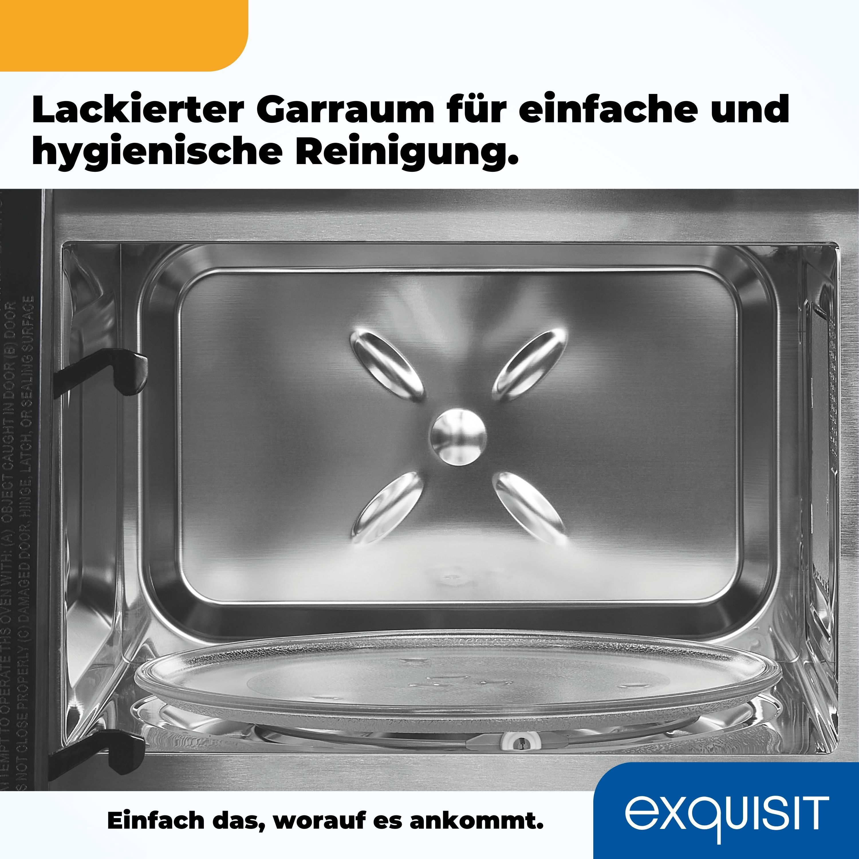 Innenraum einer Mikrowelle. Glasplatte, metallischer Innenraum und Text oben.