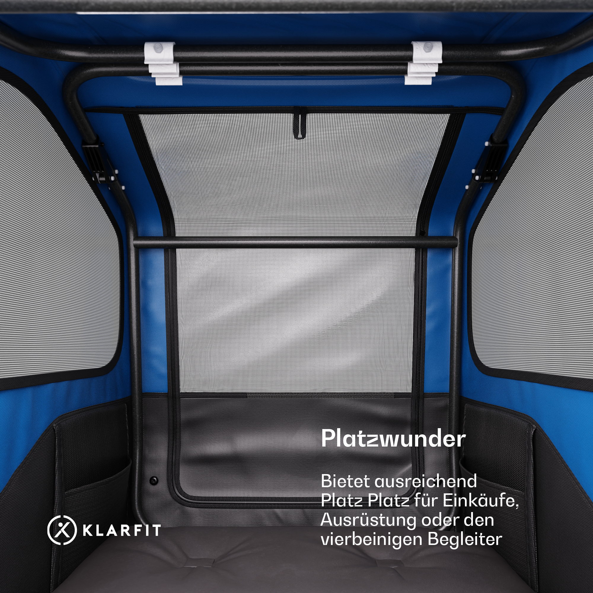 Blauer Tier-Träger-Innenraum. Schwarze Stangen, Netzfenster, weiße Clips. Text: Platzwunder, mit Text.