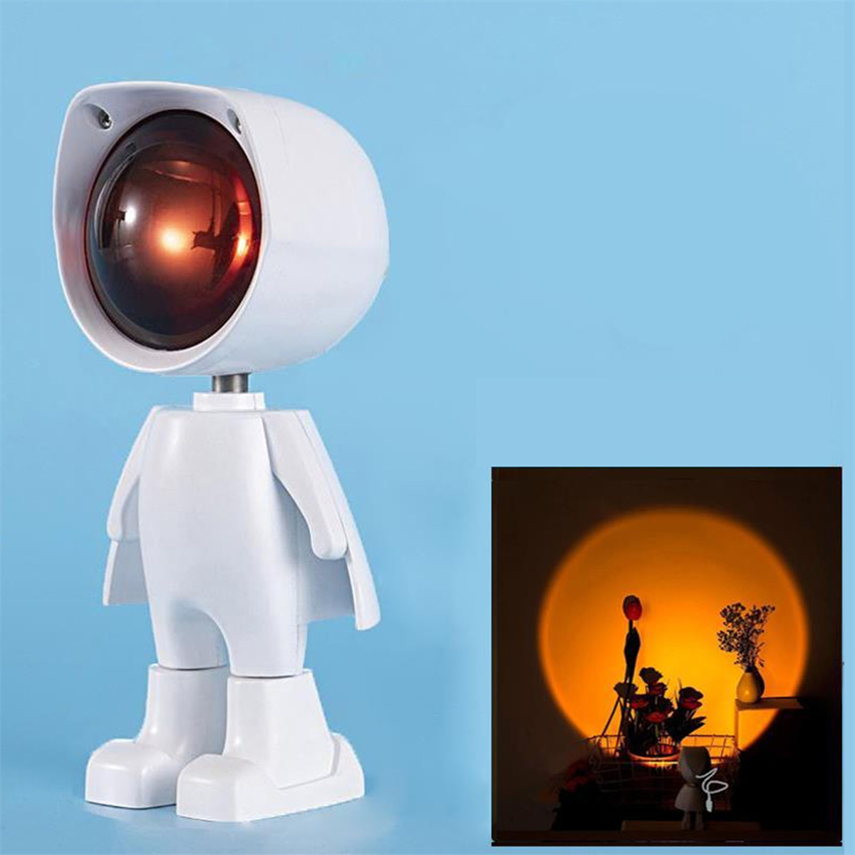 Weiße roboterartige Lampe mit rotem Licht, die einen Sonnenuntergangseffekt projiziert.