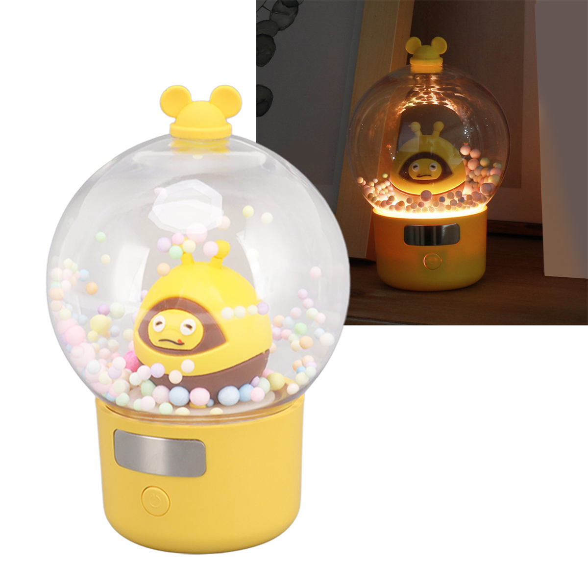 Gelbe und klare Schneekugel-Lampe mit bienenartiger Figur und Licht.