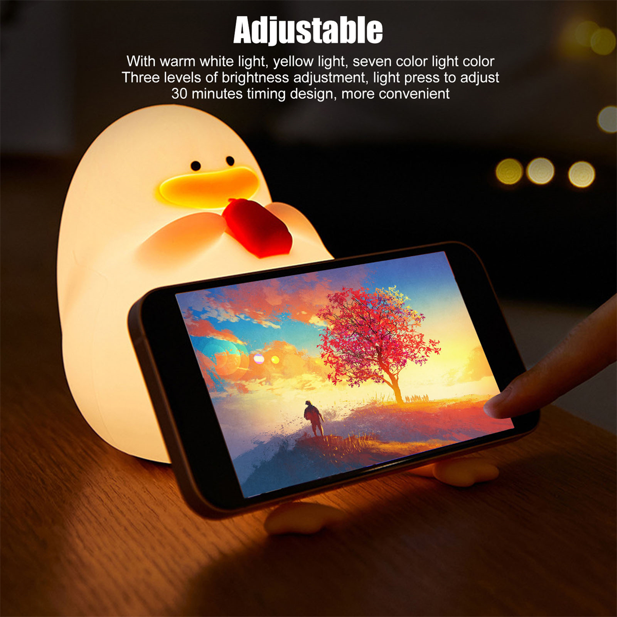 Eine Entenlampe, die ein Handy mit einem Bild hält.