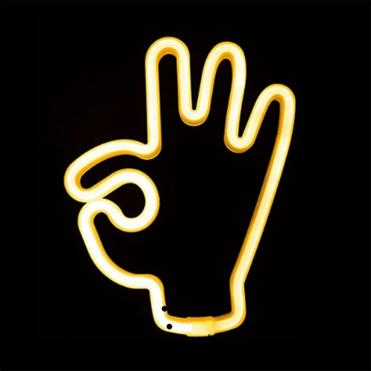 Gelbe Neon-Handgeste. Die Hand macht das 'OK'-Zeichen vor schwarzem Hintergrund.
