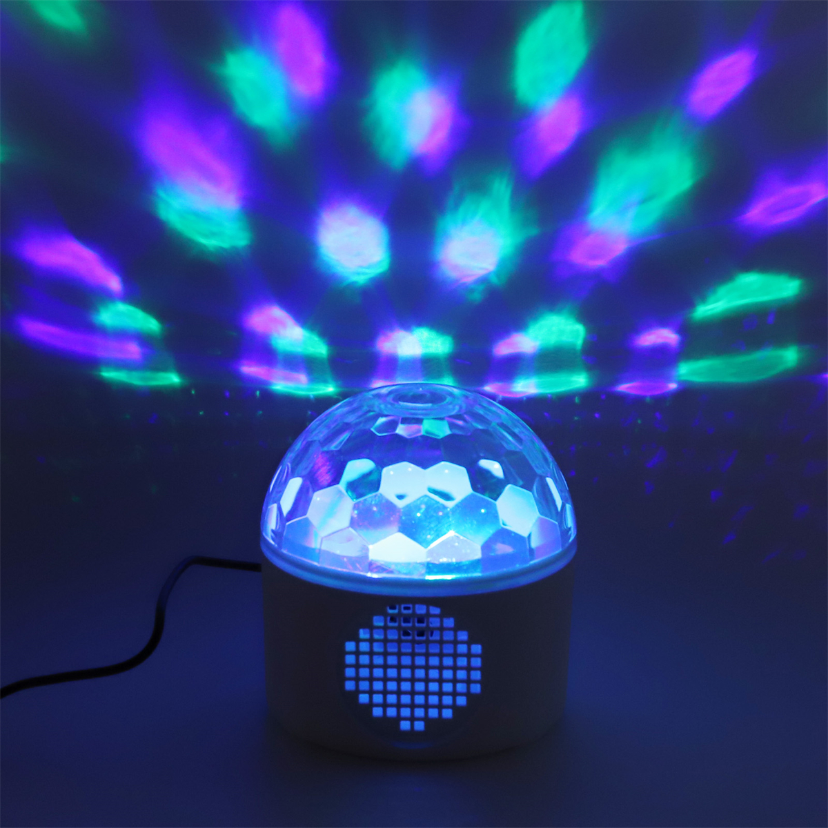 Weißes Licht im Discokugel-Stil, das blaue und grüne Muster projiziert.