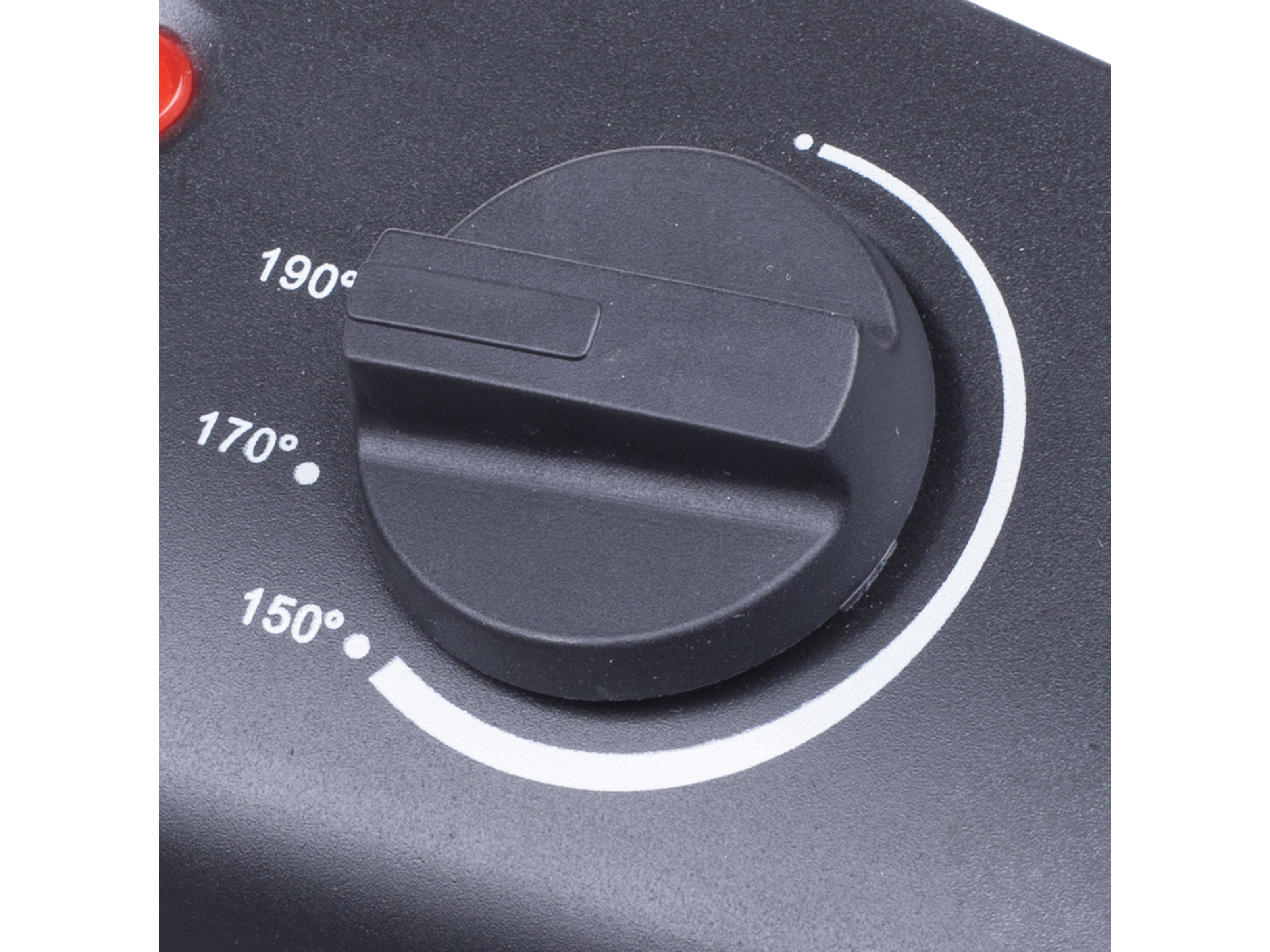 Zbliżenie czarnego pokrętła regulacji temperatury z numerami.