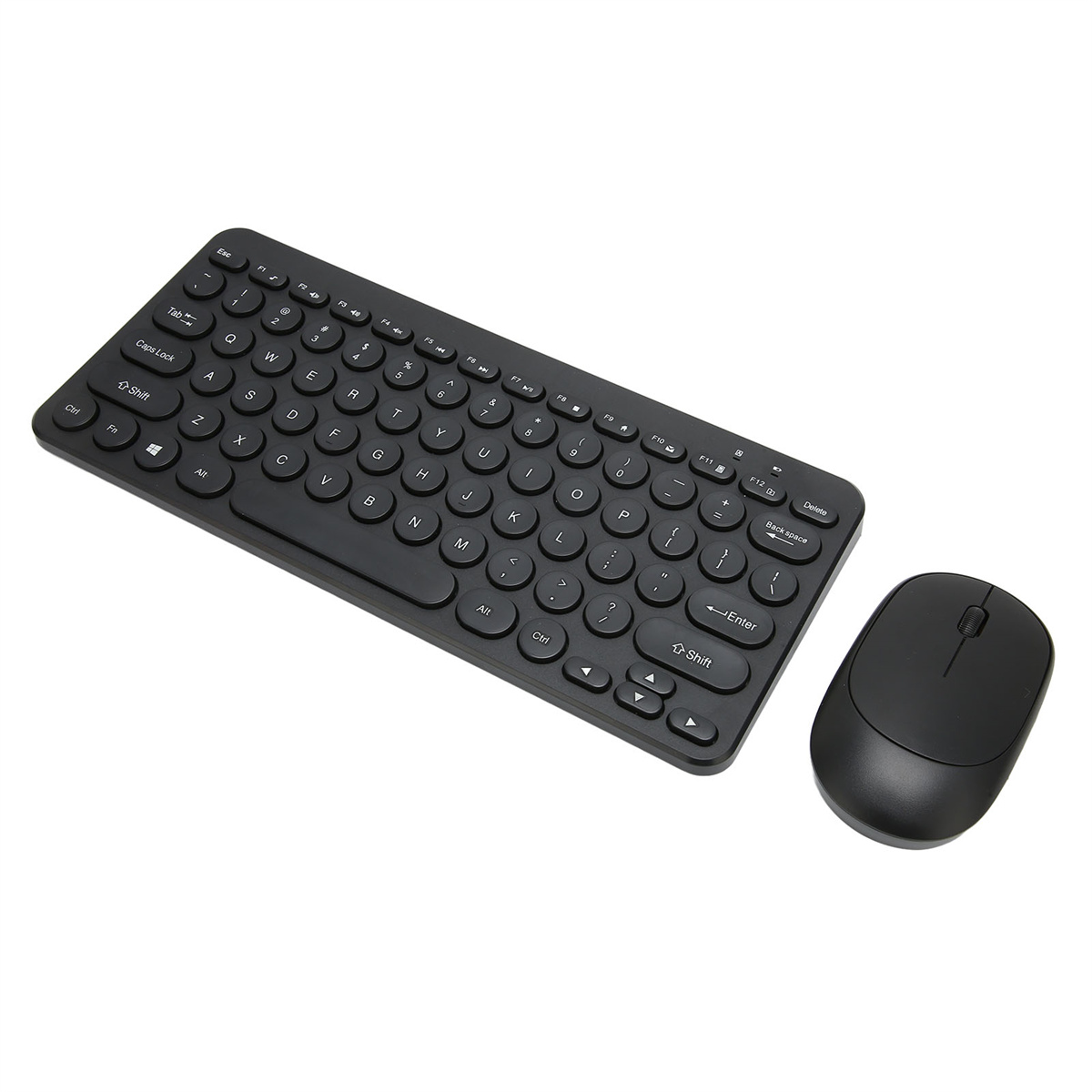 Schwarze Tastatur und Maus auf weißer Oberfläche. Die Tastatur ist kompakt und kabellos.