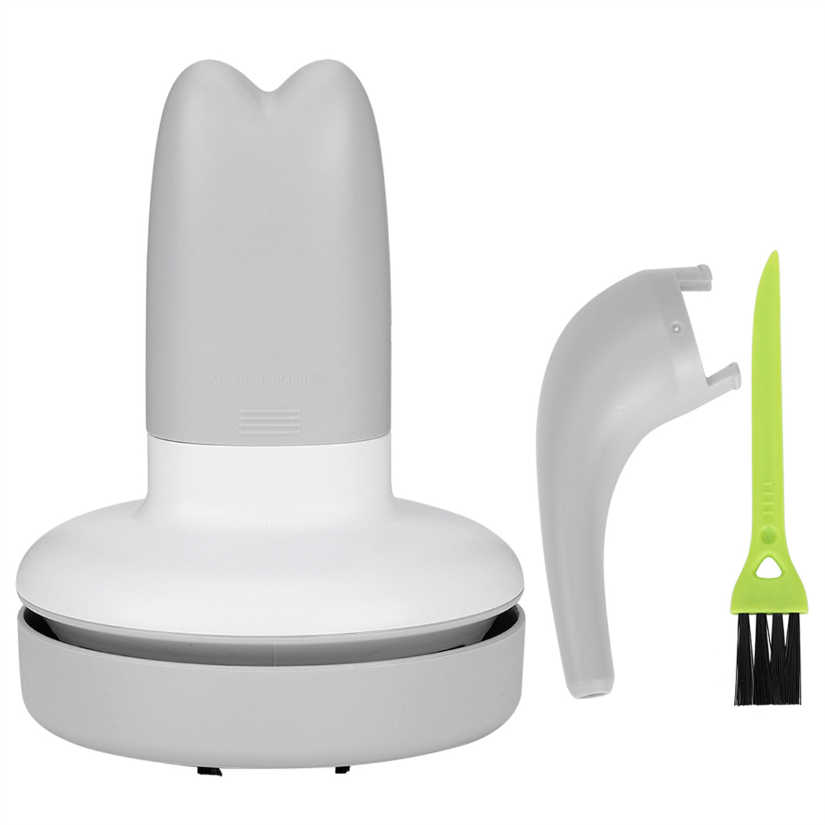 Weiß-grauer Desktop-Reiniger mit Bürste und grüner Reinigungsbürste. Isoliert auf Weiß.
