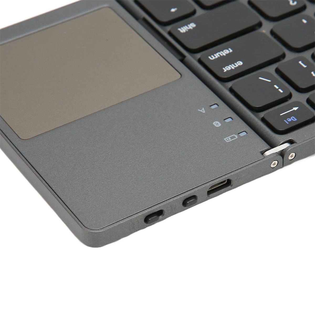 Nahaufnahme einer grauen Tastatur mit Touchpad und Funktionstasten.