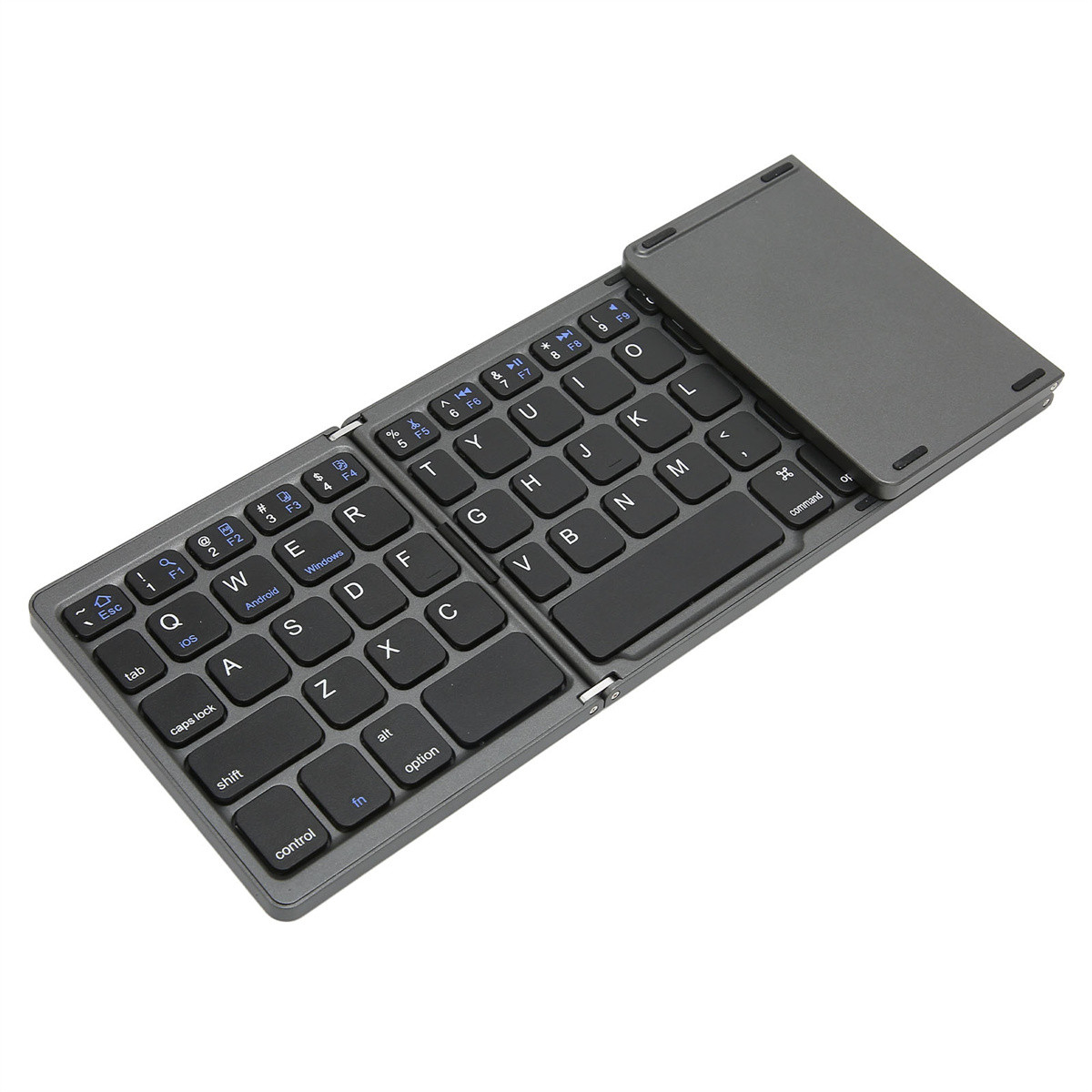 Faltbare graue Tastatur auf weißer Oberfläche. Tasten sind sichtbar, Tastatur ist geöffnet.