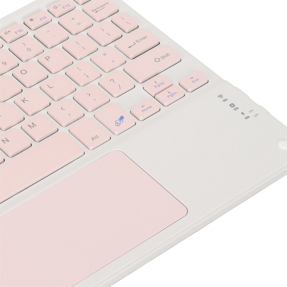 Rosa und weiße Tastatur mit rosa Trackpad. Schwarzer Drucker im Hintergrund. Weißer Hintergrund.