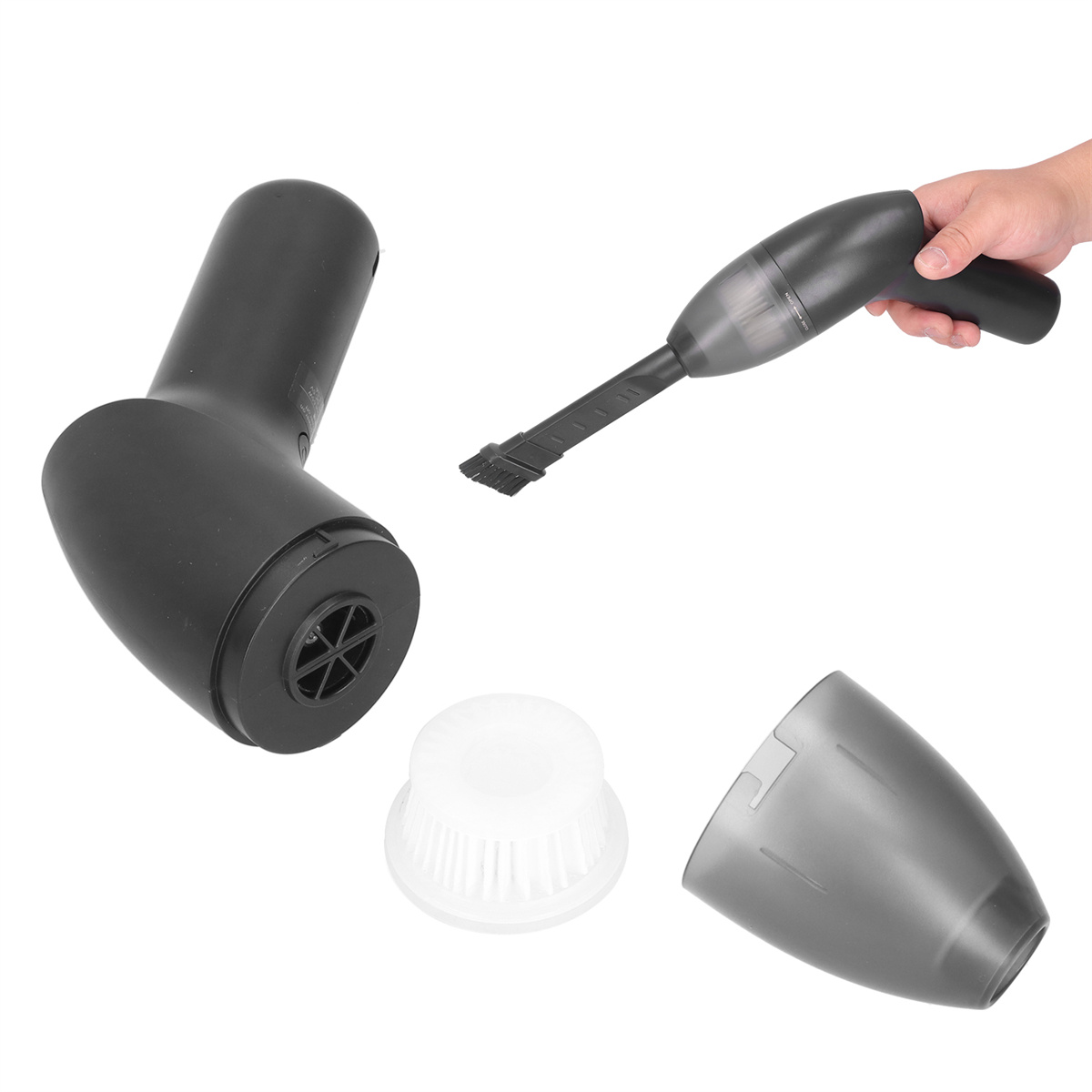 Teile eines schwarzen Staubsaugers zerlegt: Gehäuse, Bürste, Staubfilter und Hand, die die Düse hält.