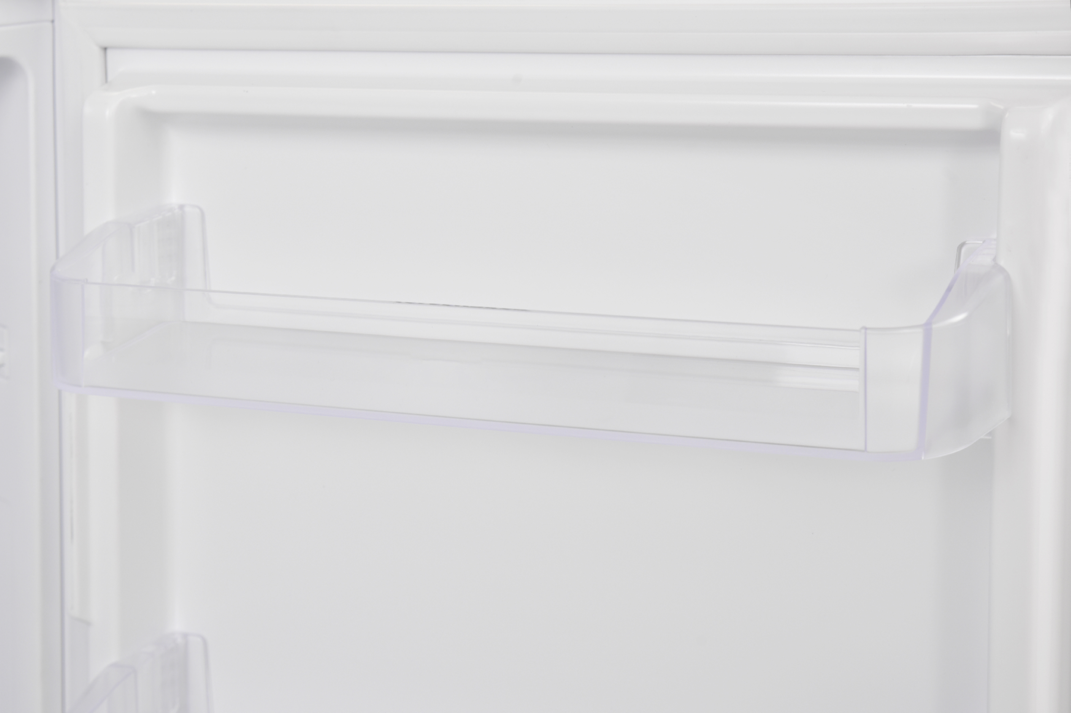 An open white refrigerator, showcasing a clear plastic shelf inside the door.