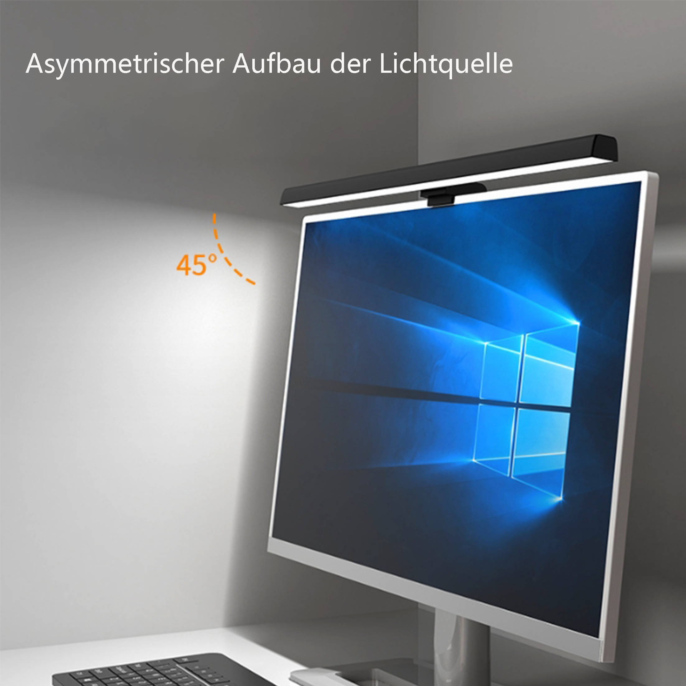 LED-Lichtleiste über einem Computerbildschirm. Weißes Licht, schwarzer Balken. Grauer und weißer Wandhintergrund.