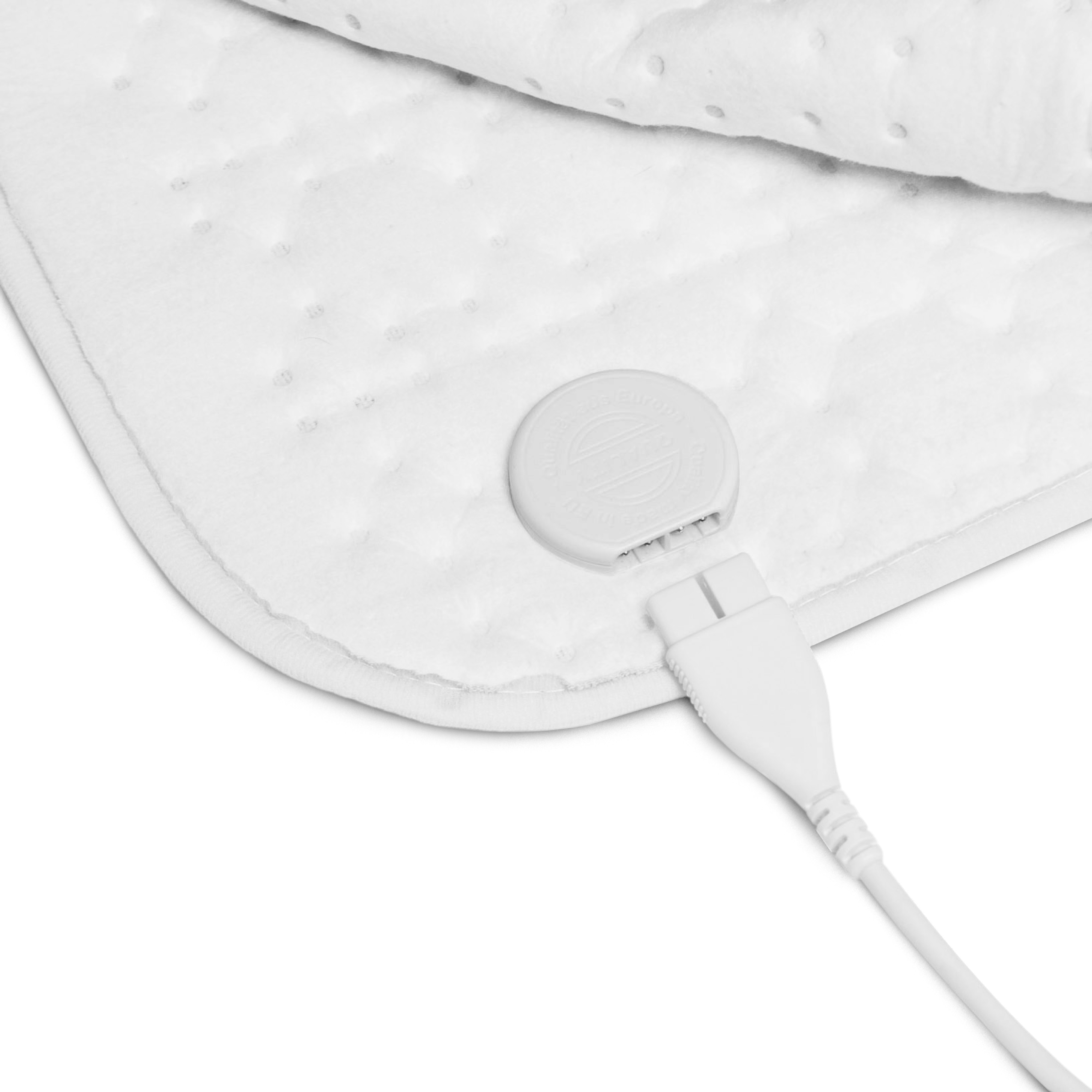 White electric heating pad with a control panel and power cord, close-up view.