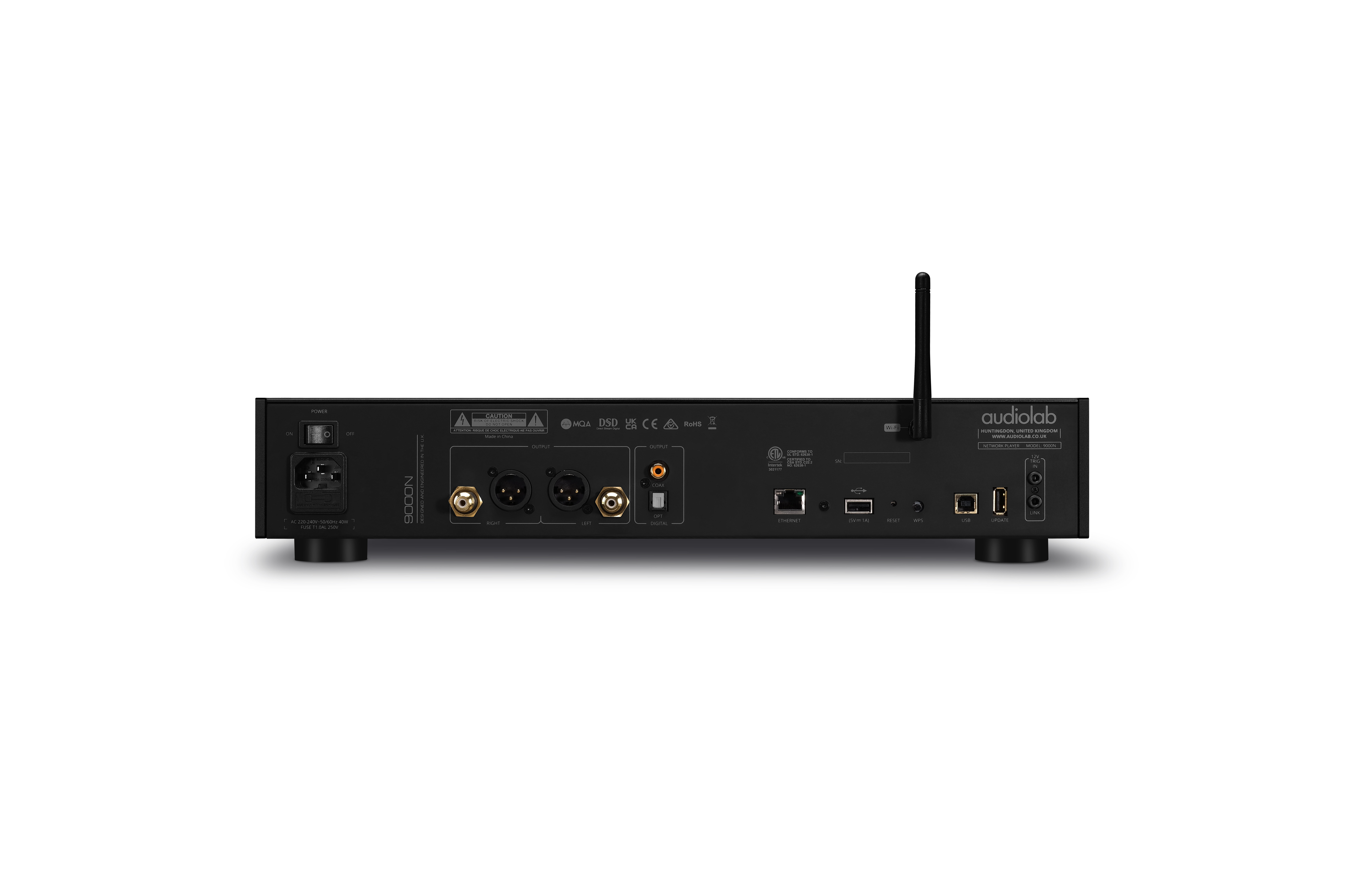 Black audio device with various input/output ports, antenna, and a power button. White background.