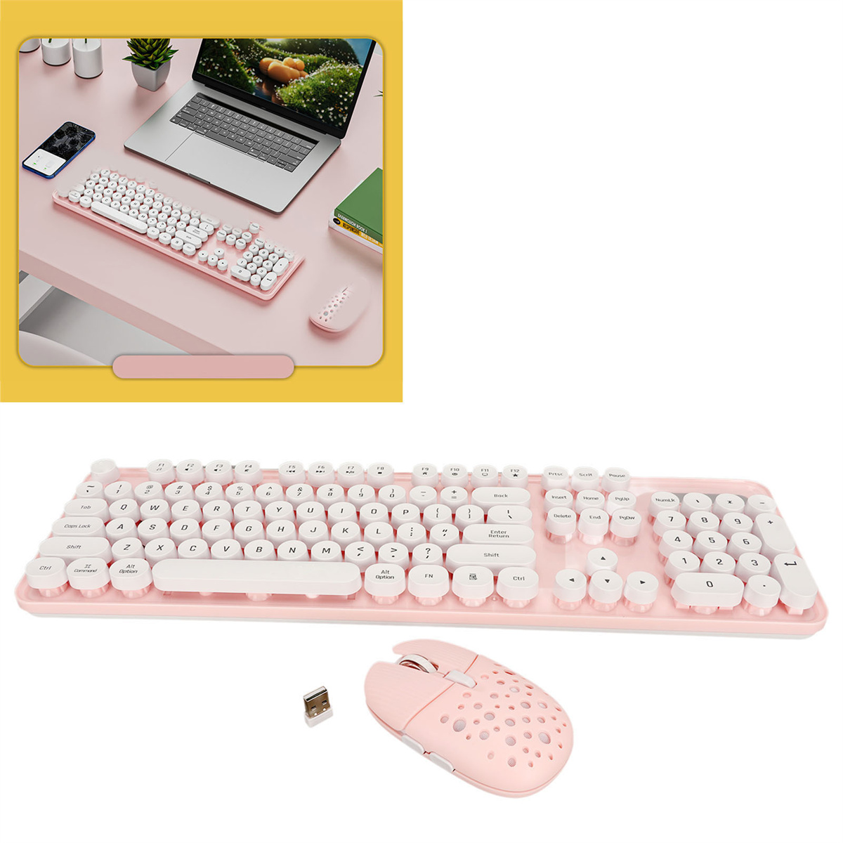 Rosa Tastatur und Maus auf einem rosa Schreibtisch mit Laptop und Telefon. Draufsicht.