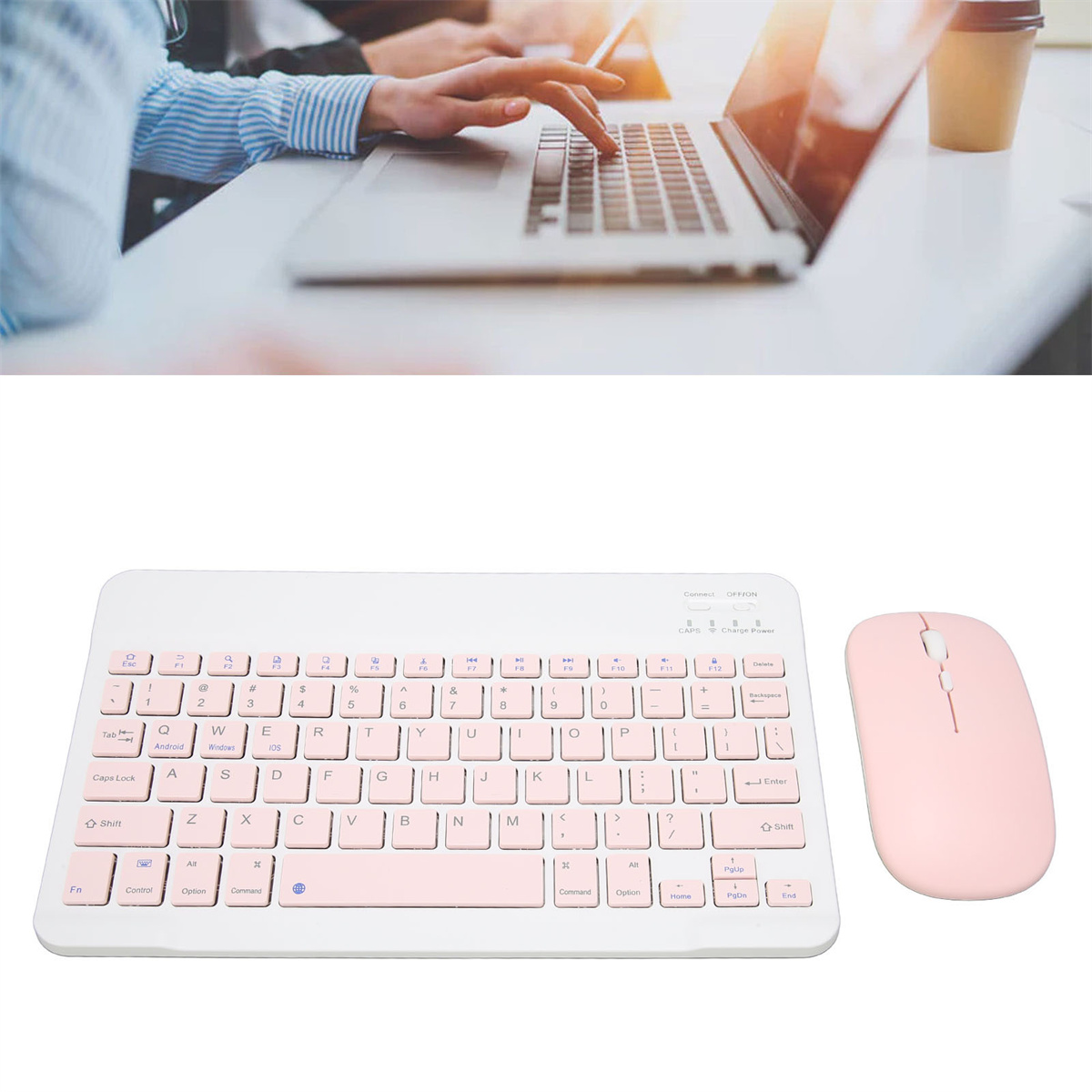 Eine Person, die im Hintergrund einen Laptop benutzt, und eine rosa Tastatur und Maus im Vordergrund.