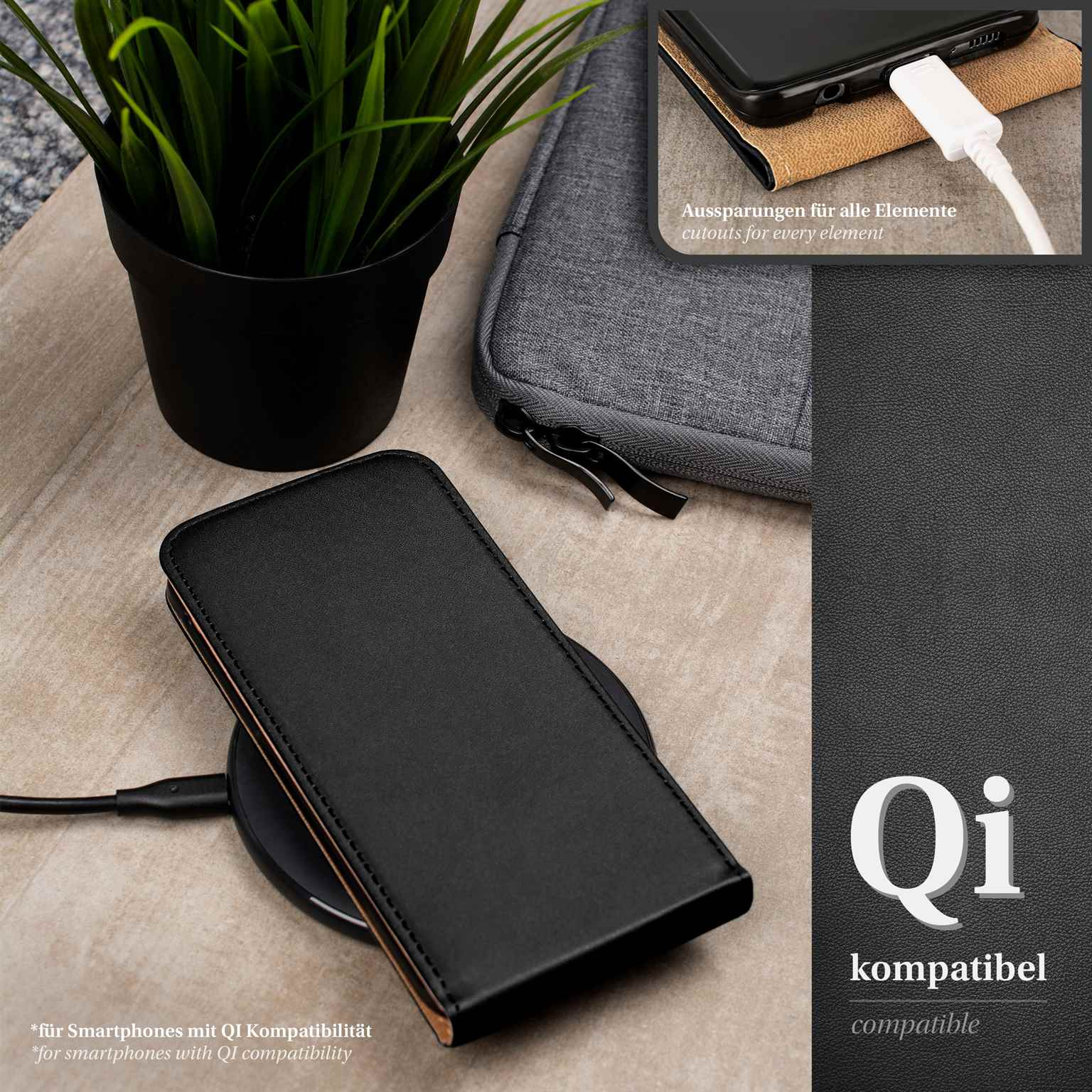 Schwarzes Telefon in schwarzer Hülle lädt kabellos. Kleine Pflanze und graue Tasche im Hintergrund.