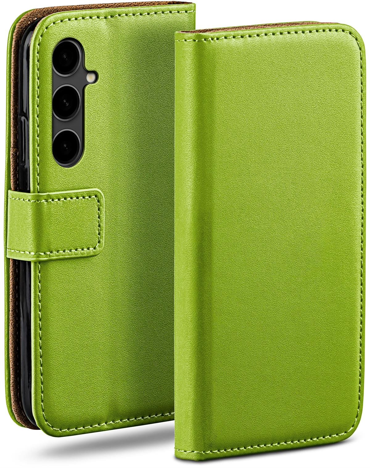 Grüne Handyhülle mit einem Telefon. Die Handyhülle ist geöffnet und zeigt einen Bildschirm und ein Telefon.